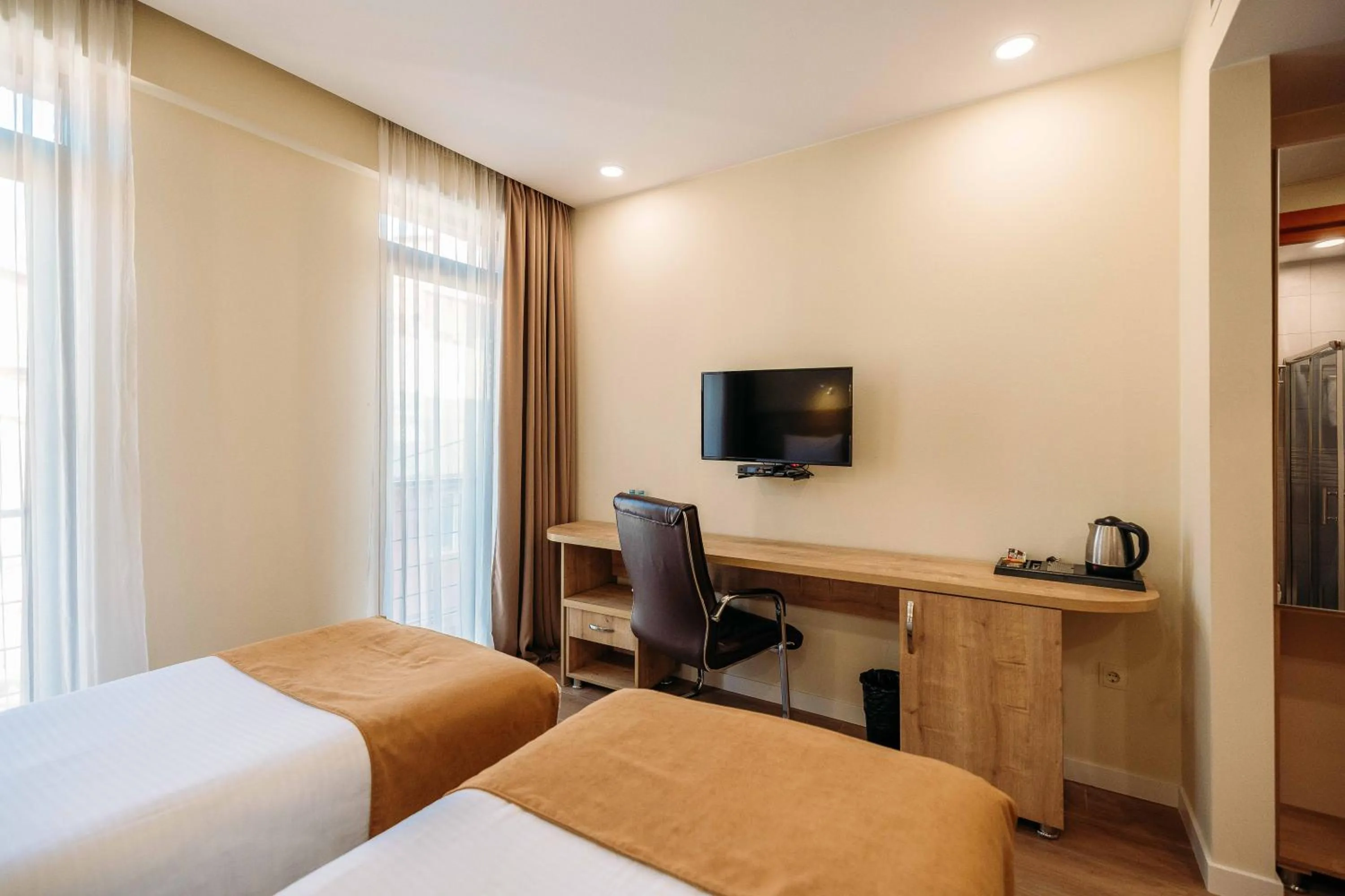 Bed in Atrium Boutique Hotel