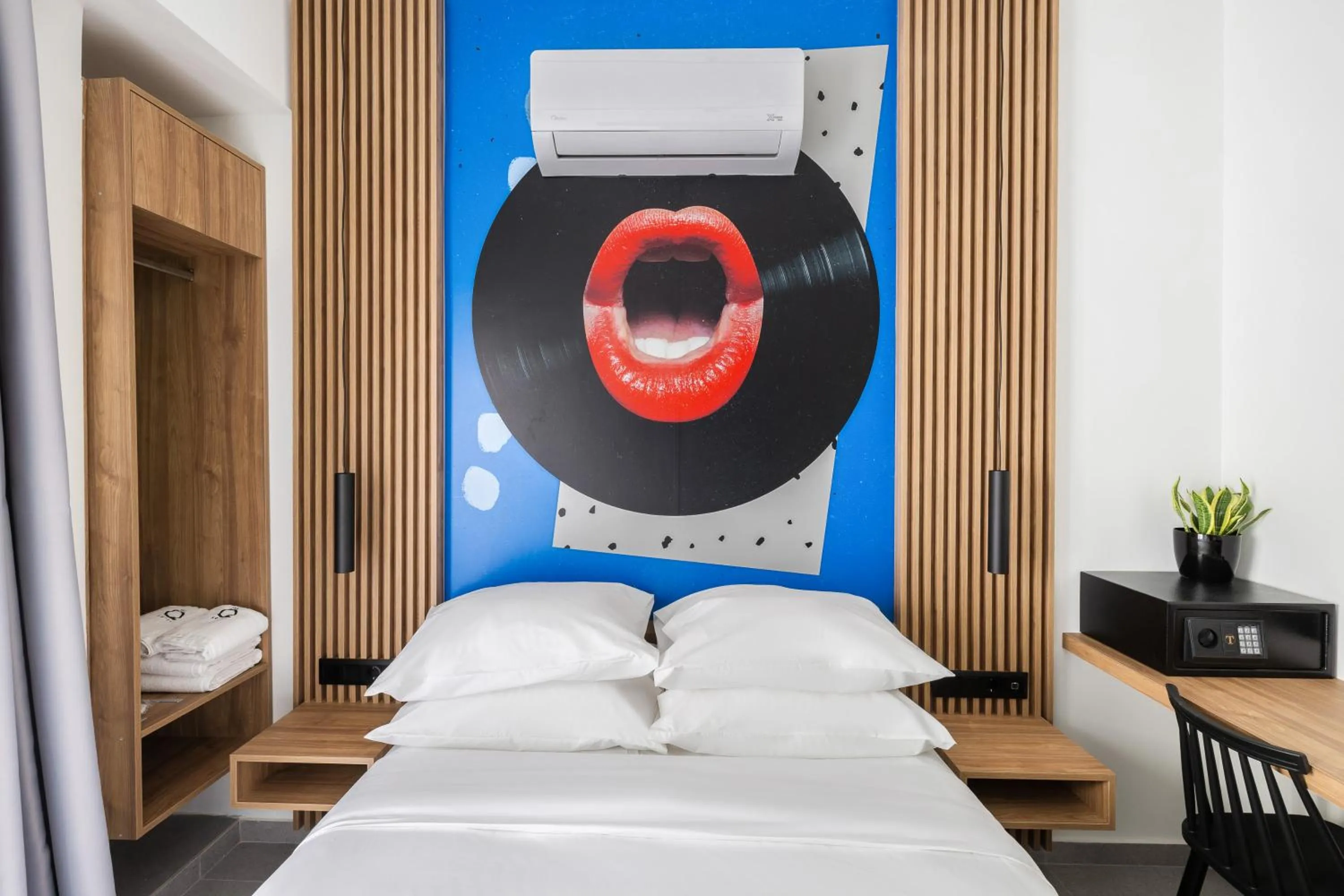 Bed in The Q Hotel