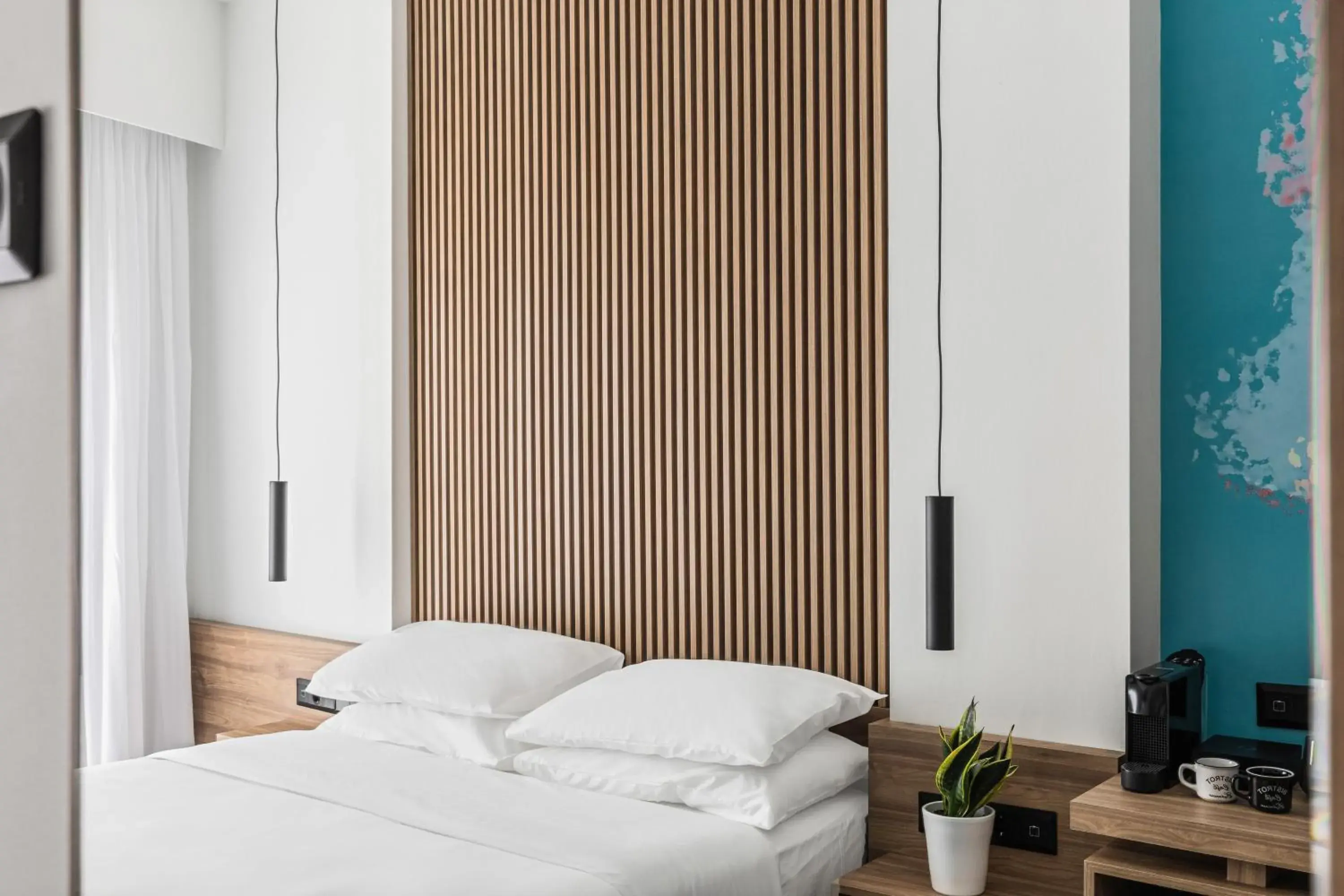 Bed in The Q Hotel Bed in The Q Hotel