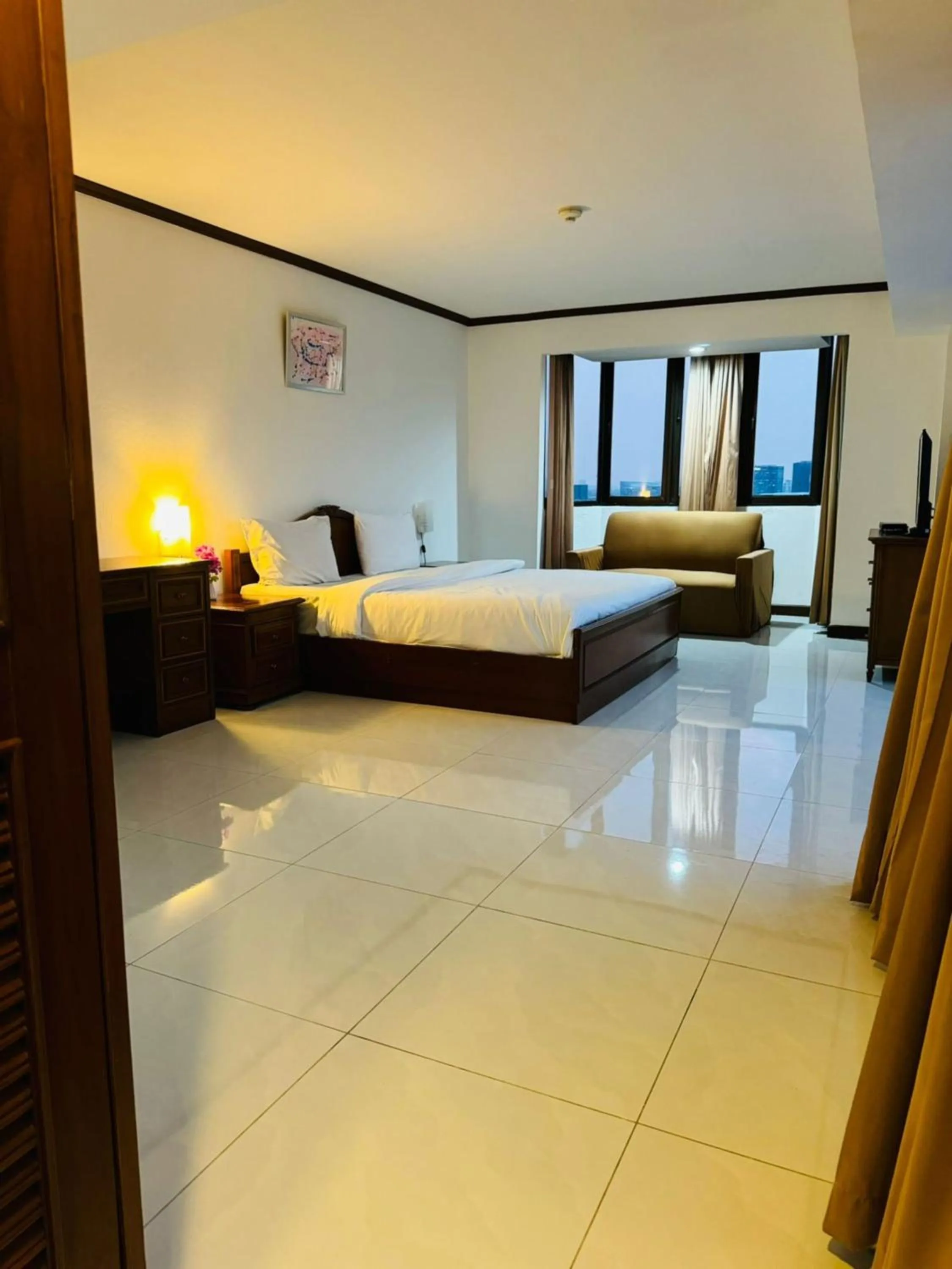 Bed in Omni Tower Cozy Apartments by Direct Rooms