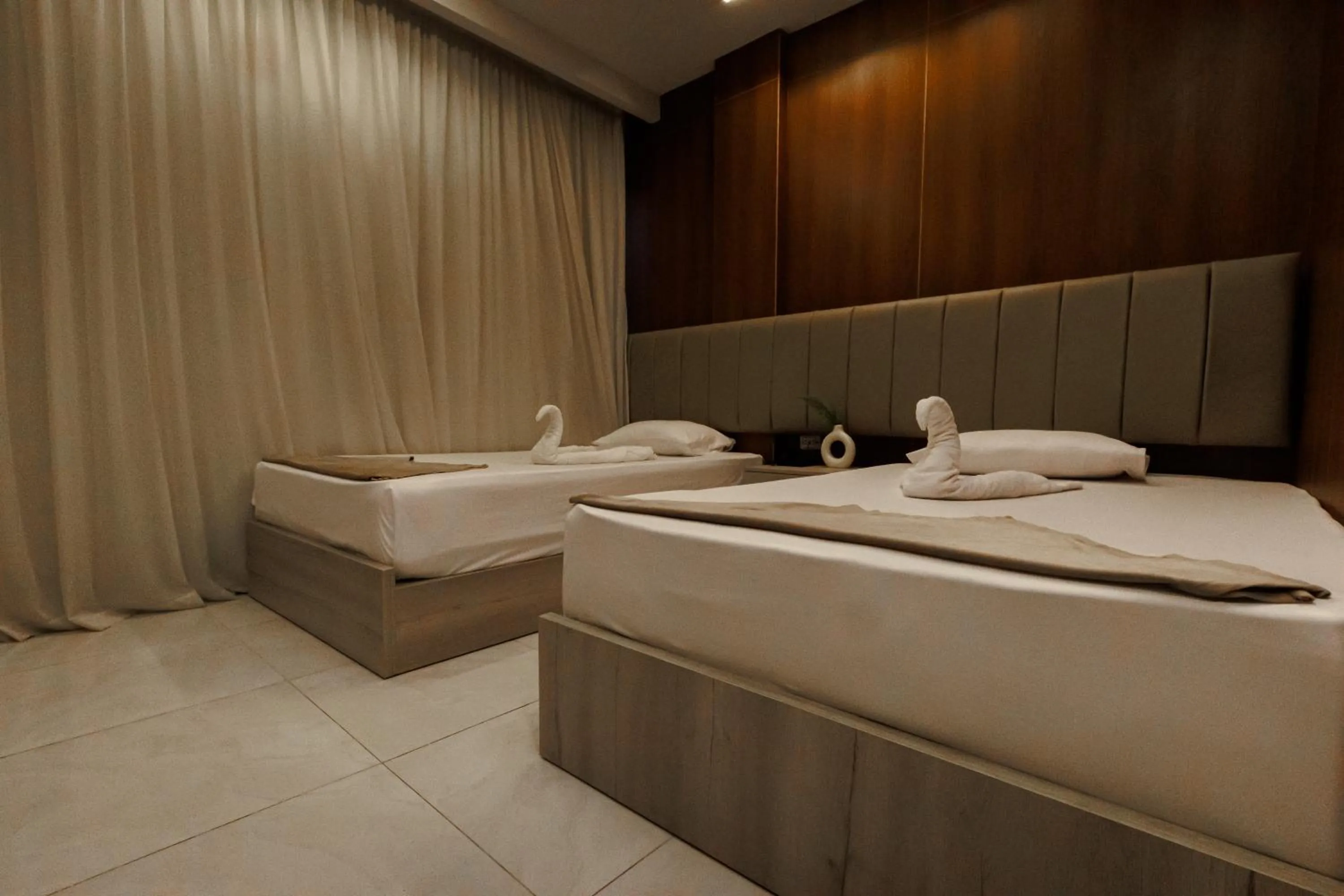 Bed in Royal Home Hotel