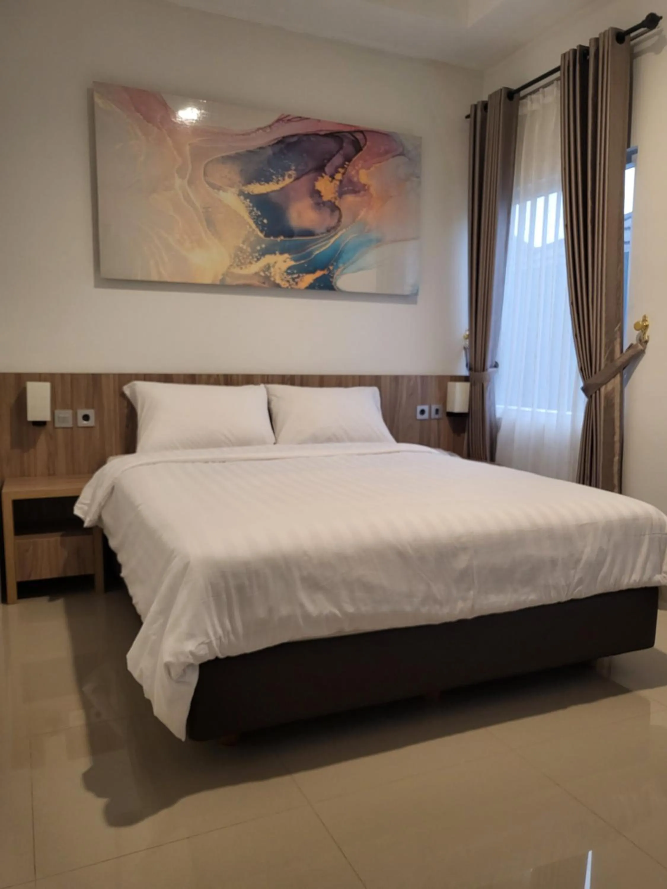 Bed in The Safiina Point Syariah Hotel