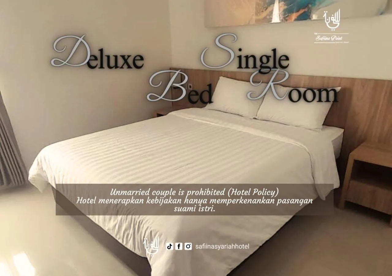 Bed in The Safiina Point Syariah Hotel