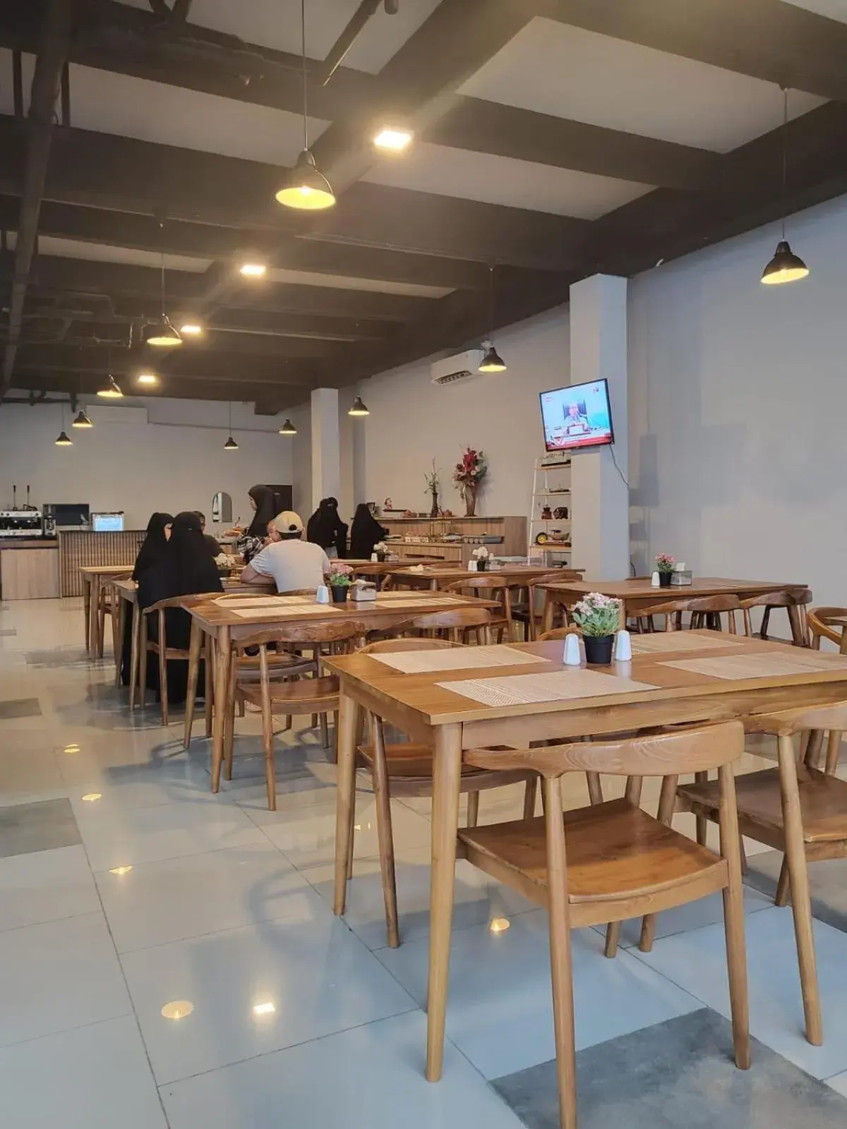 Communal lounge/ TV room in The Safiina Point Syariah Hotel Communal lounge/ TV room in The Safiina Point Syariah Hotel