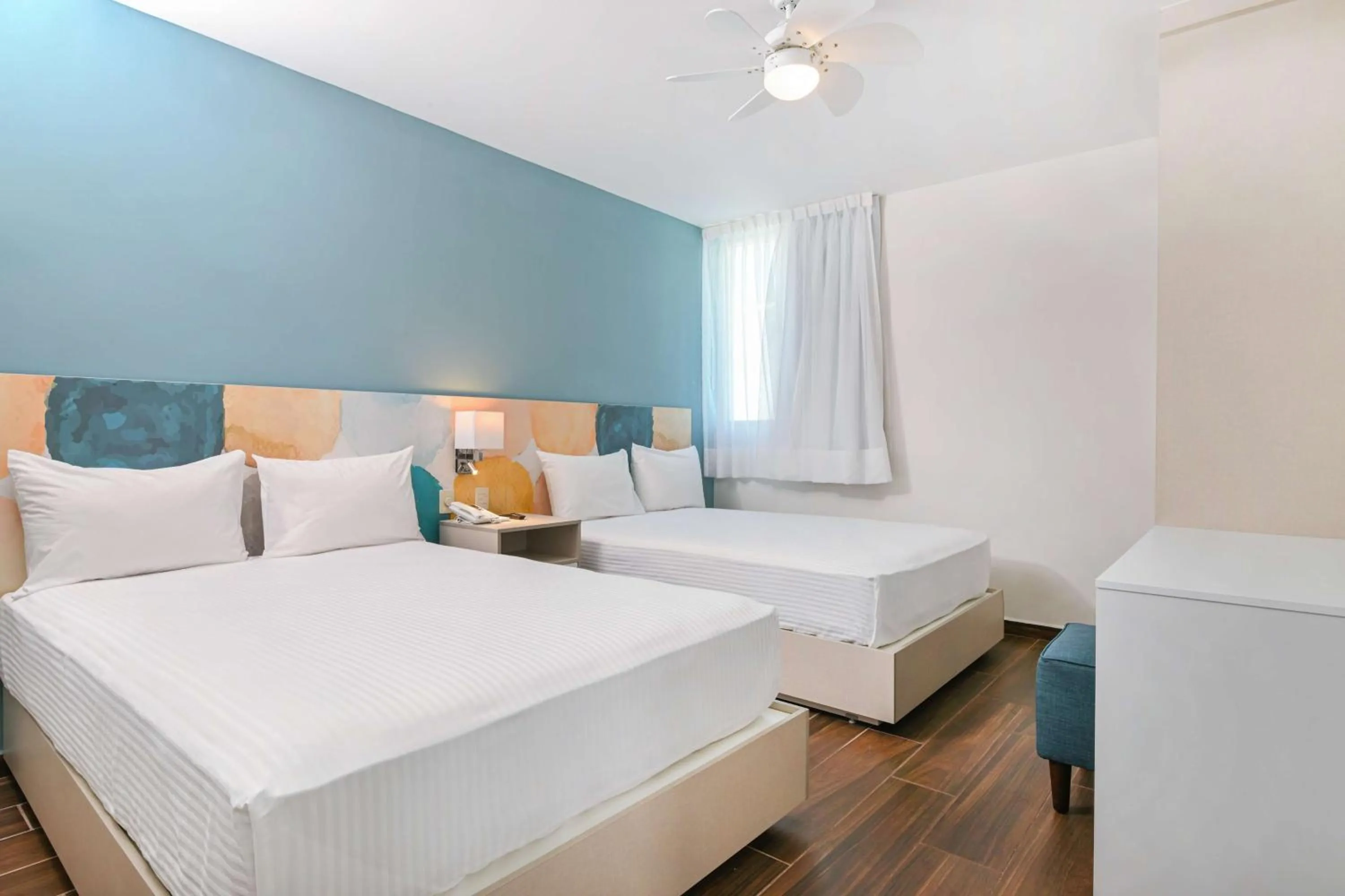 Bedroom, Bed in Vista Express Guadalajara Expo SureStay Collection by BW