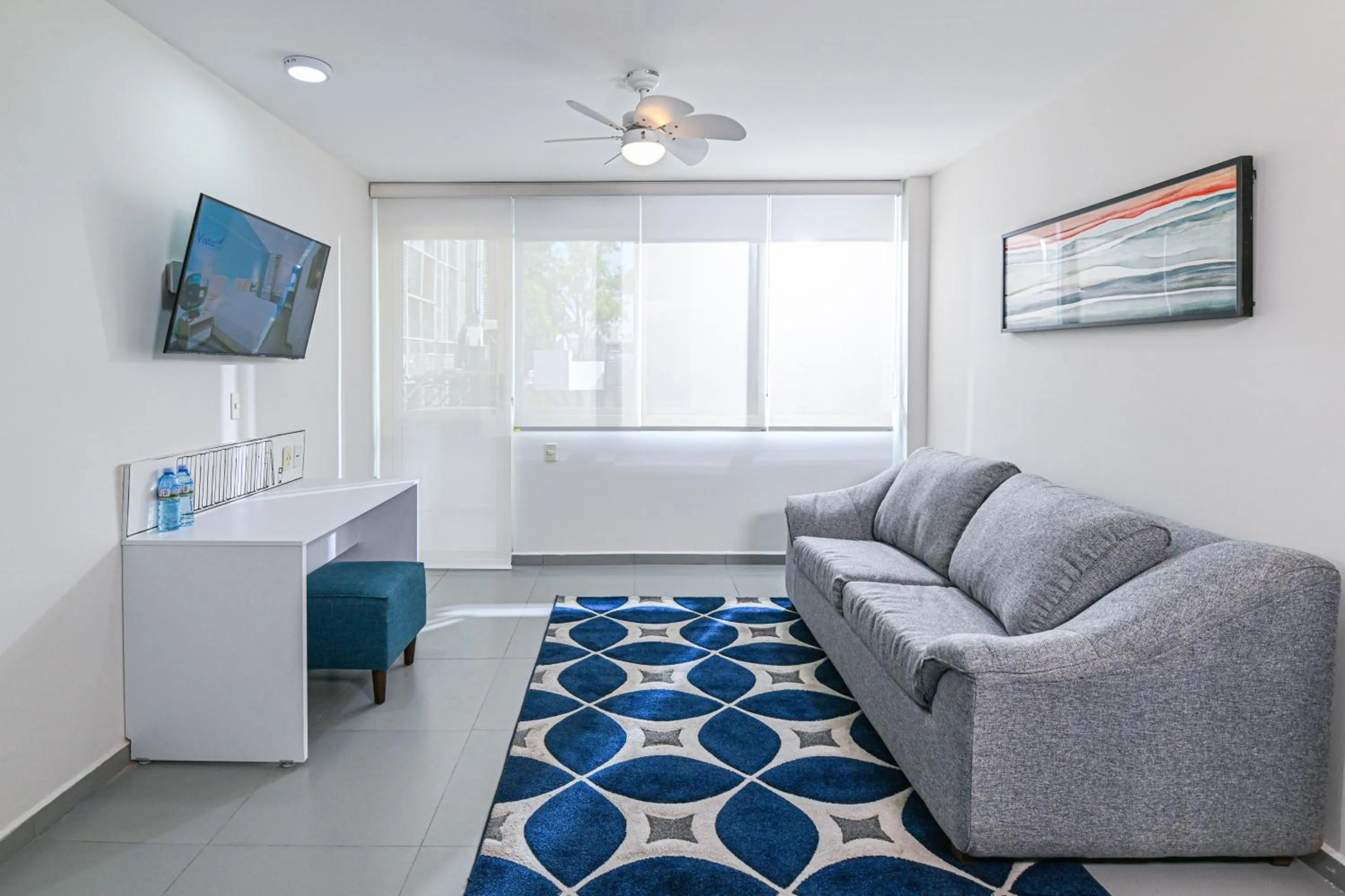 Living room in Vista Express Guadalajara Expo SureStay Collection by BW