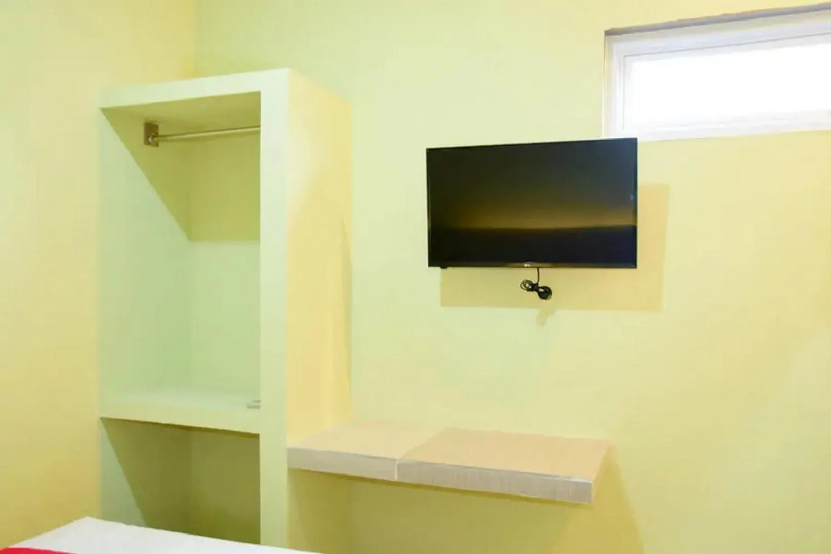 TV and multimedia in RedDoorz near Mangga Dua Square