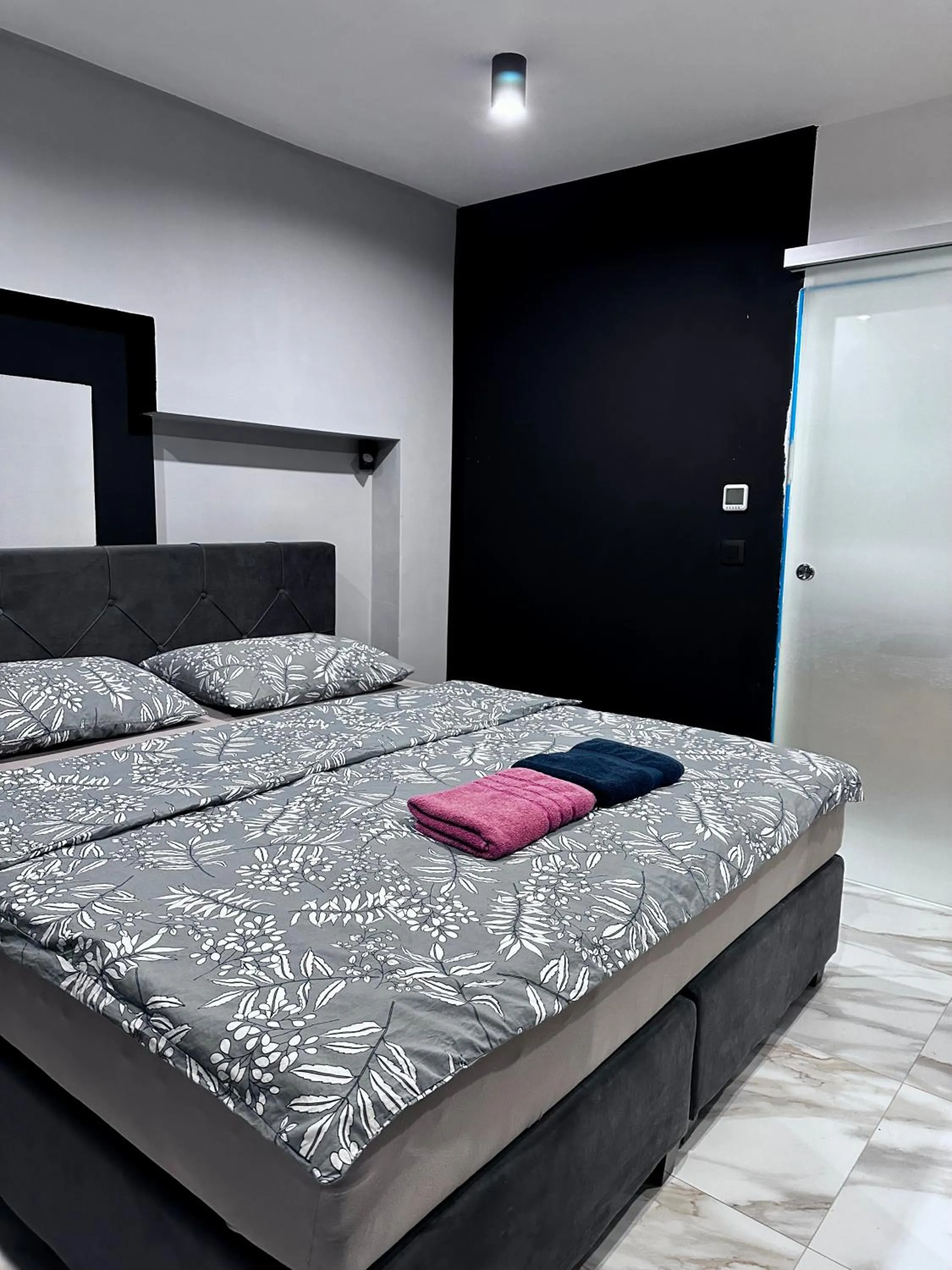 Bed in Allegra Rooms