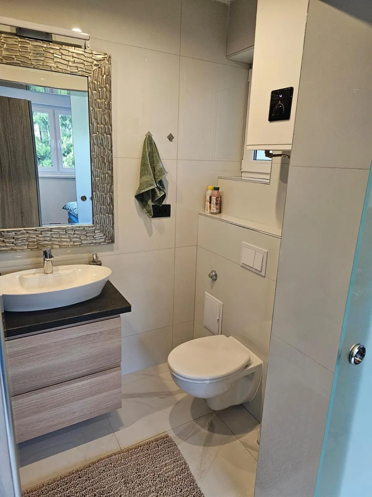 Toilet in Allegra Rooms