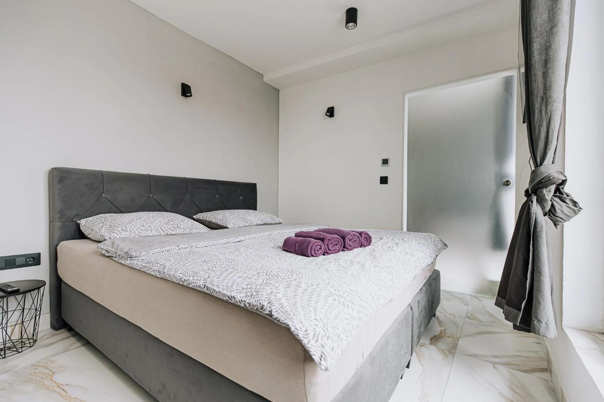 Bed in Allegra Rooms