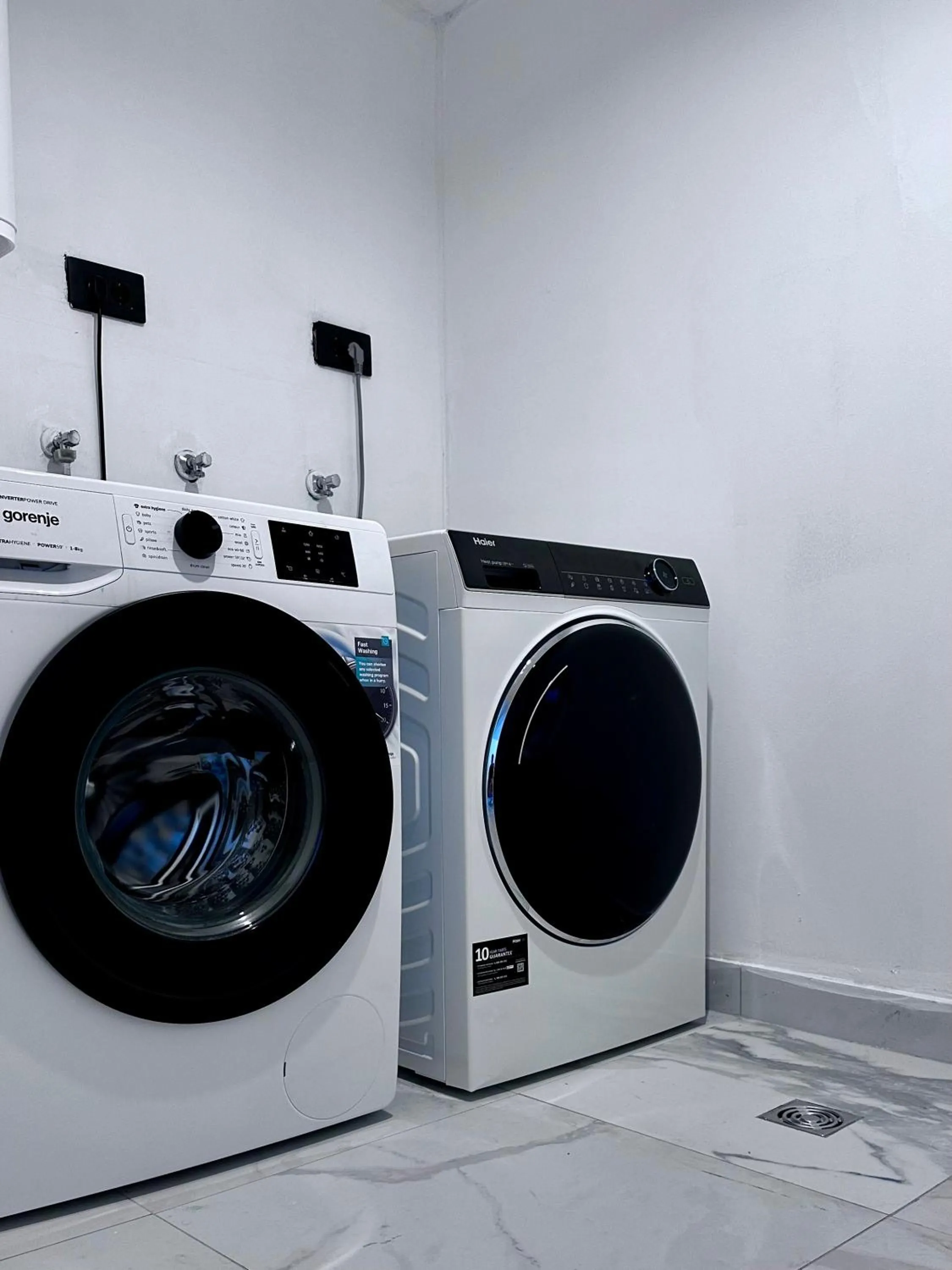 washing machine in Allegra Rooms