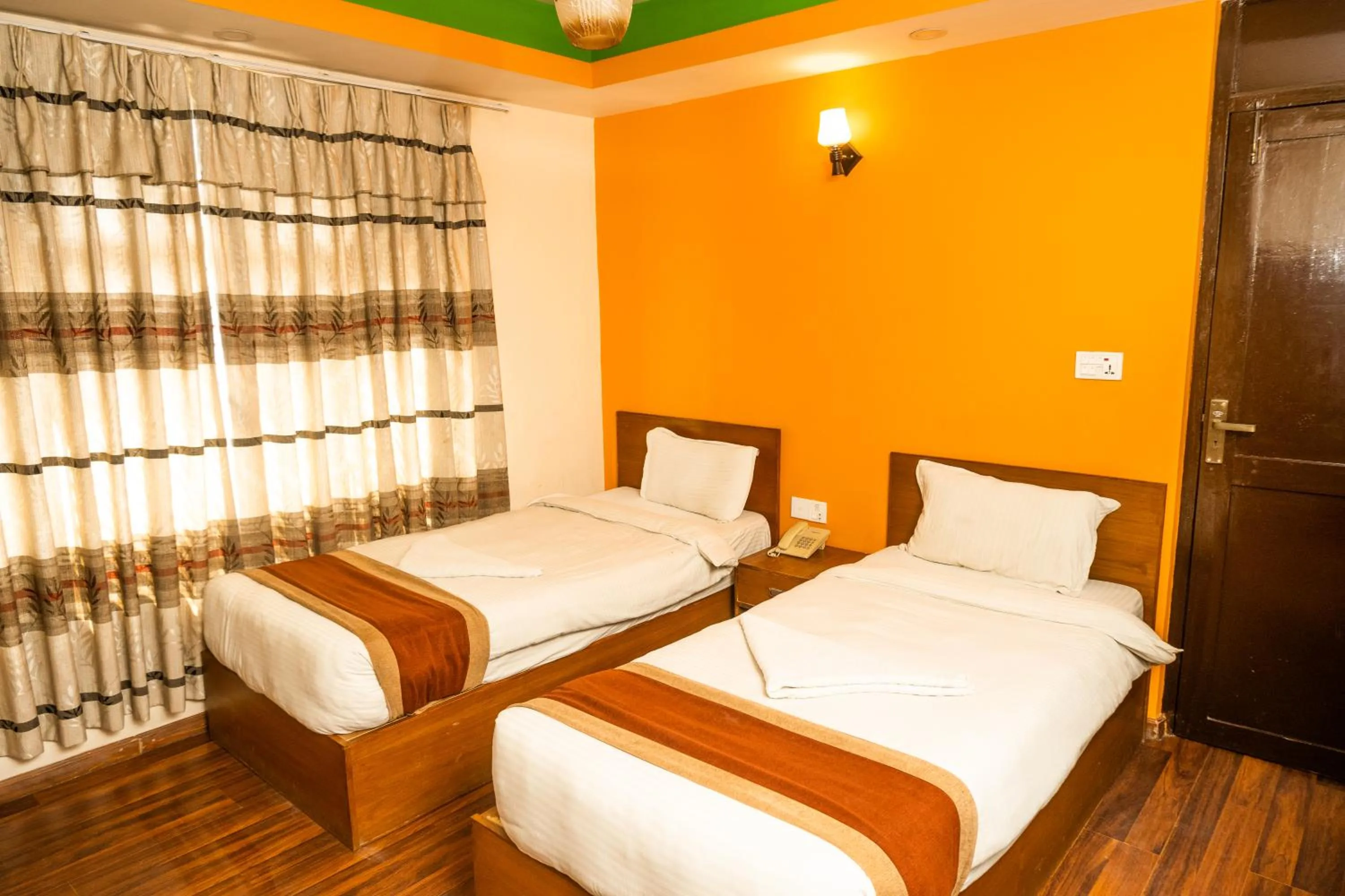 Photo of the whole room, Bed in Kathmandu Peace Hotel