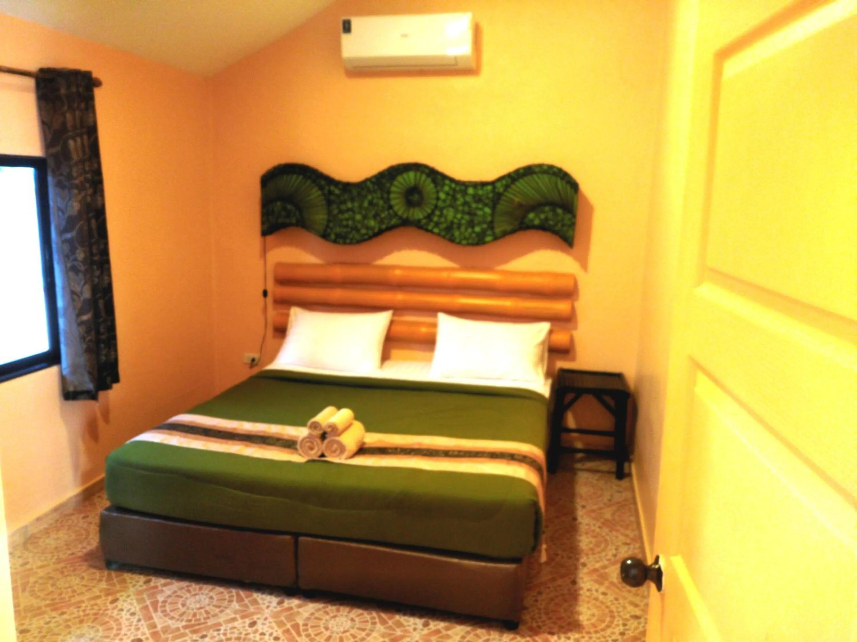 Bedroom in Kamala Tropical Garden Hotel