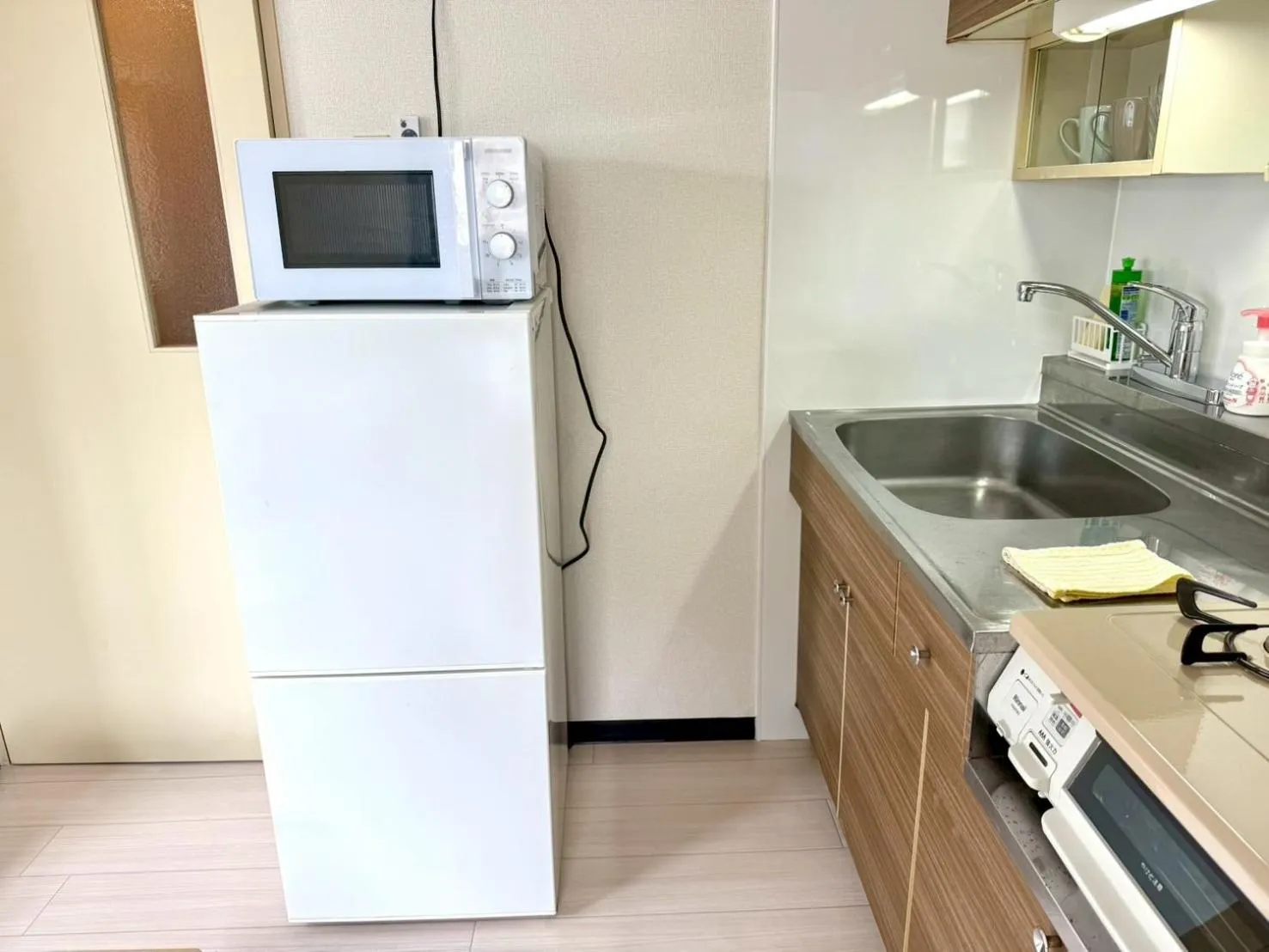 Kitchen or kitchenette in KIYAZA Space Sapporo 2