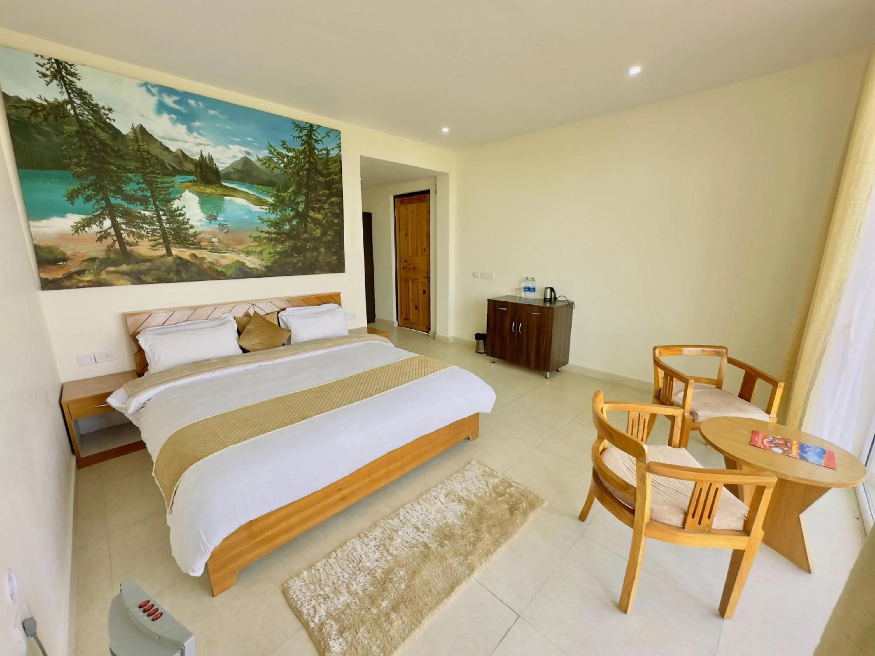Photo of the whole room, Bed in Shree Parijat Resort - Luxury Resort in Mukteshwar