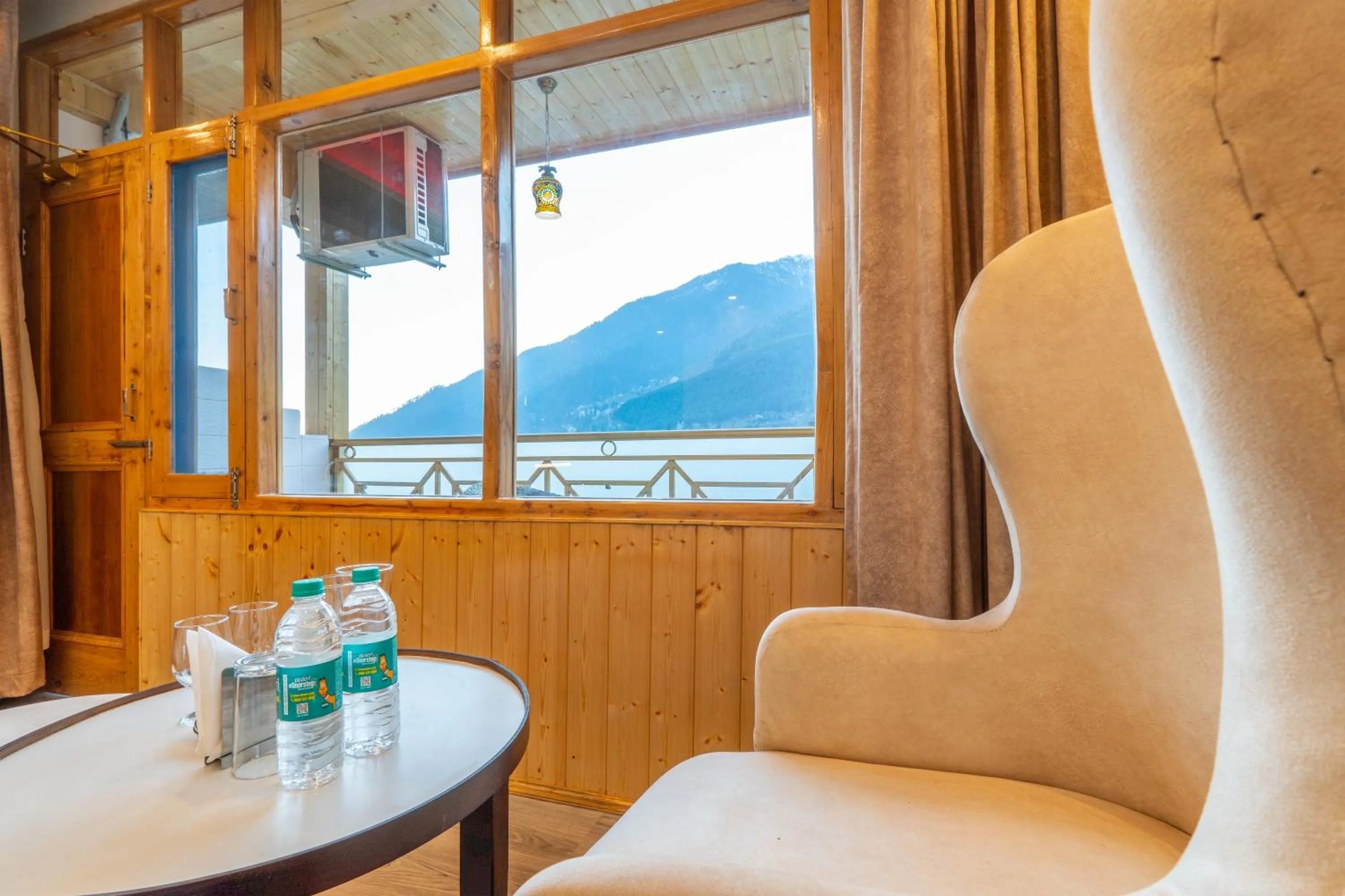 Seating area in Hill River Resort By West Western -Property of the Year 2024-25 - Central Heated & Air Cooled, Near Mall Road