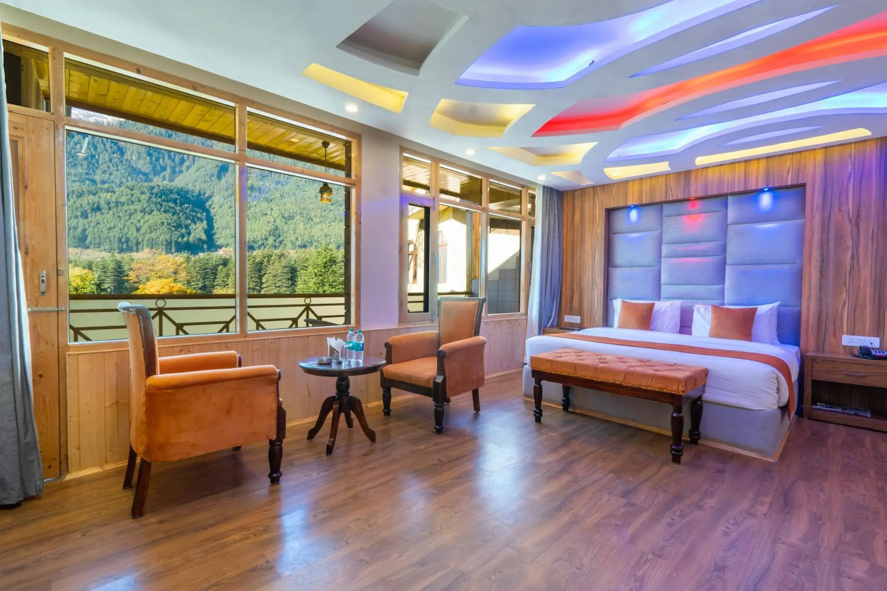 Seating area, Bed in Hill River Resort By West Western -Property of the Year 2024-25 - Central Heated & Air Cooled, Near Mall Road Seating area, Bed in Hill River Resort By West Western -Property of the Year 2024-25 - Central Heated & Air Cooled, Near Mall Road