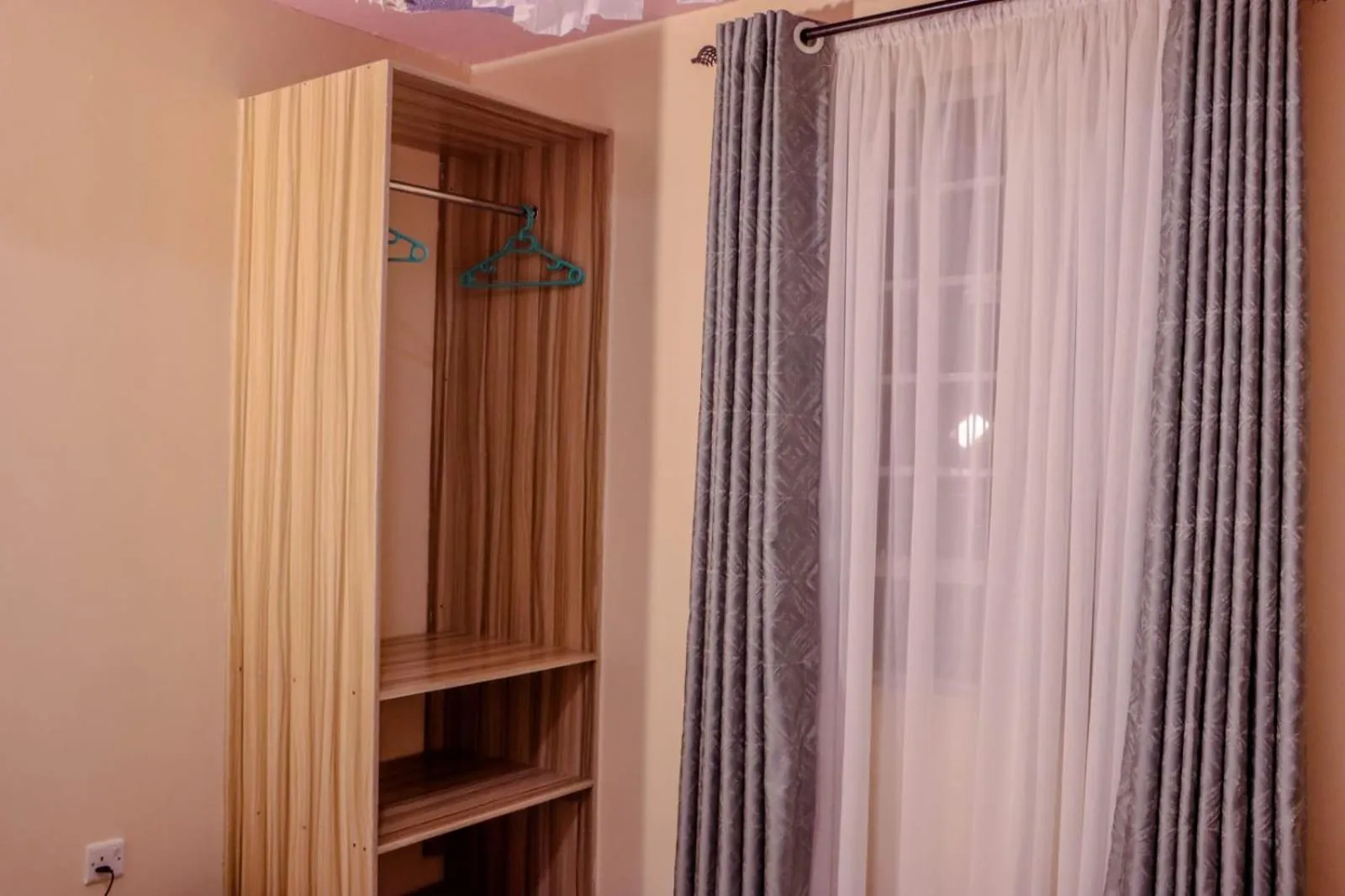 wardrobe in Dayo Suites and Hotel