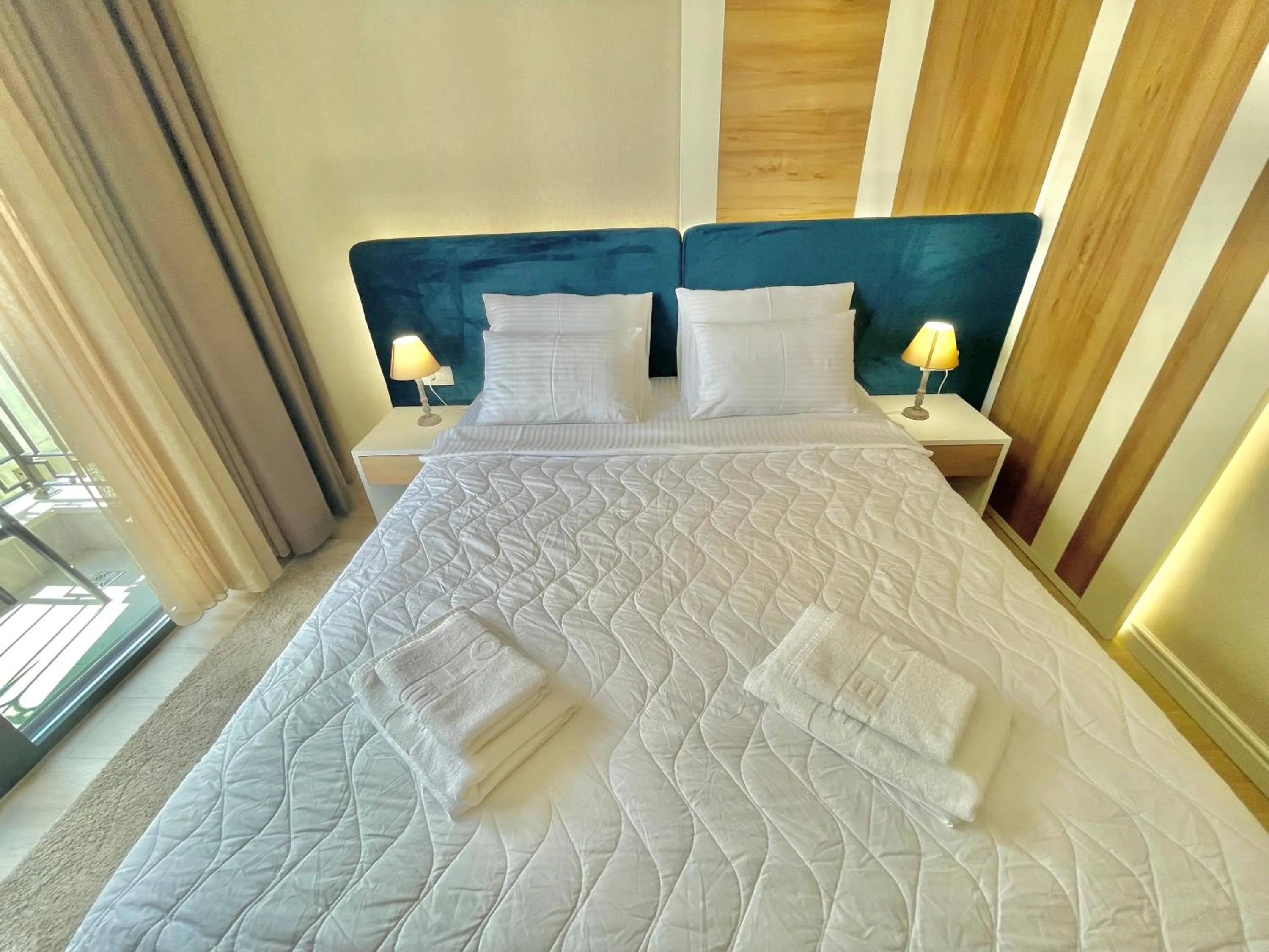 Bedroom, Bed in Comfort Apartments Pasha