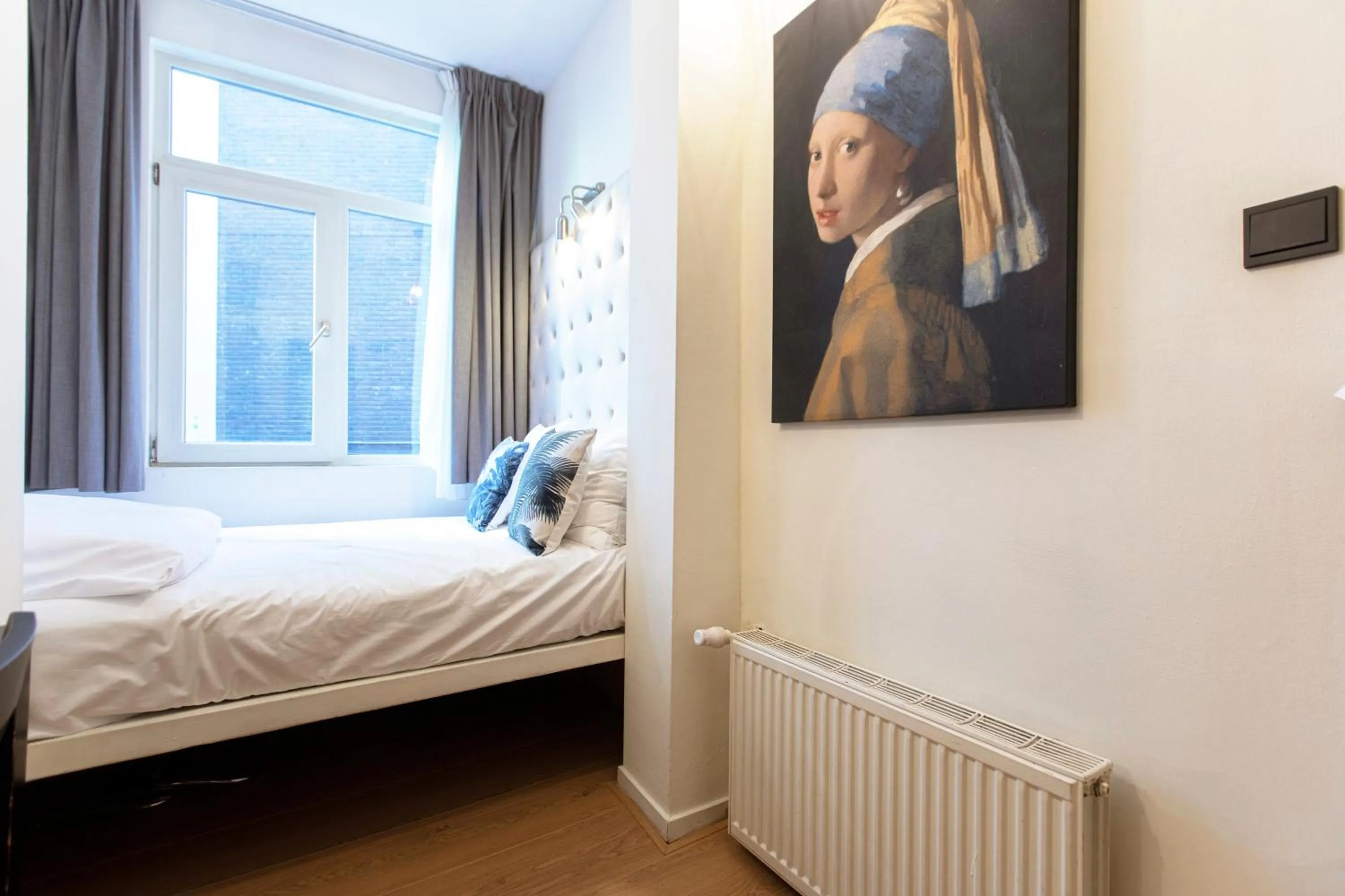 Bed in Quentin Amsterdam Hotel