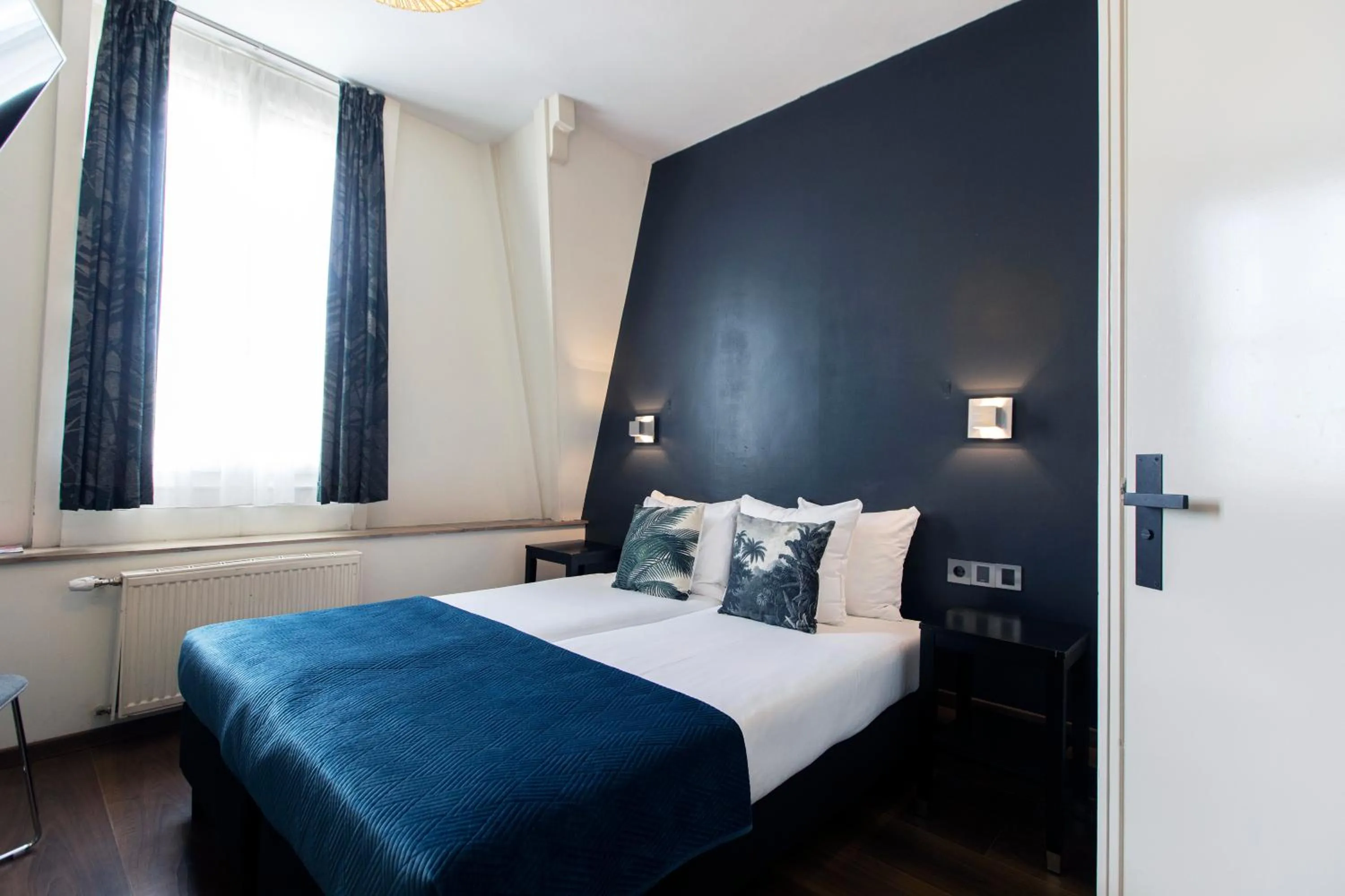 Bed in Quentin Amsterdam Hotel