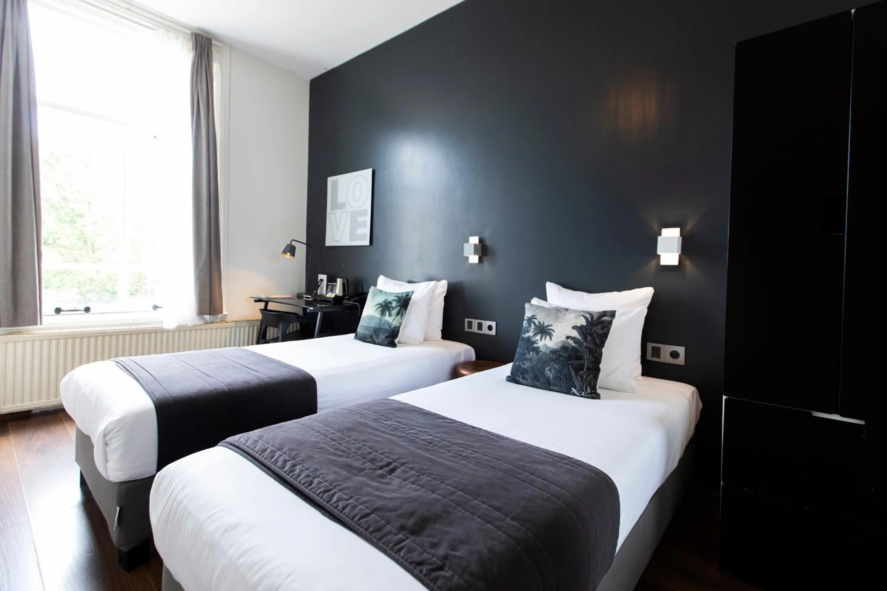 Bed in Quentin Amsterdam Hotel