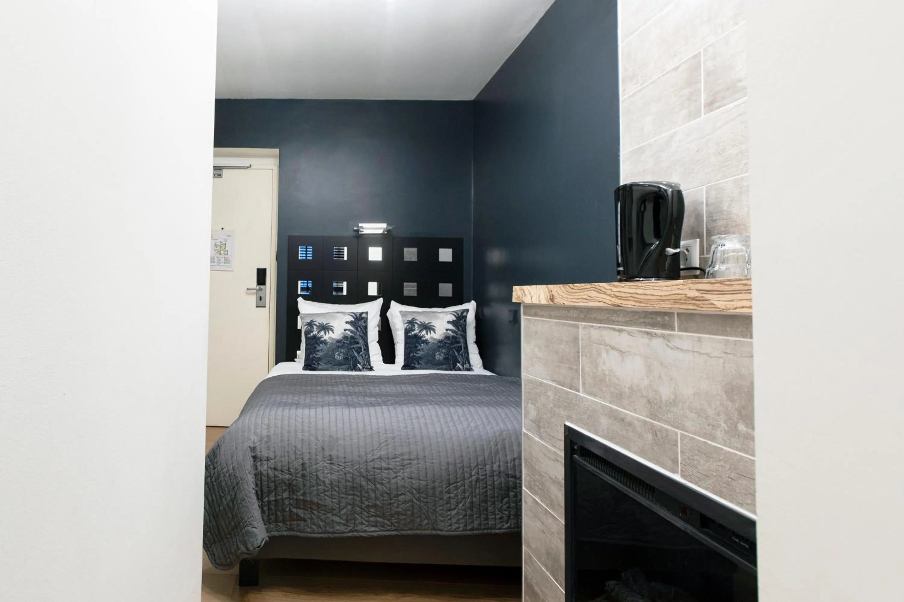 Bed in Quentin Amsterdam Hotel