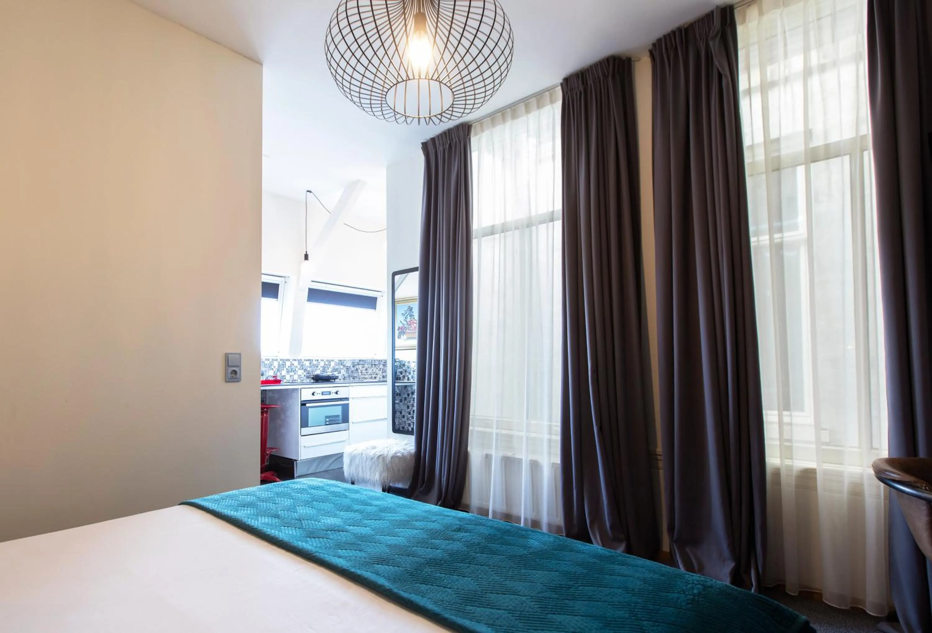 Bed in Quentin Amsterdam Hotel