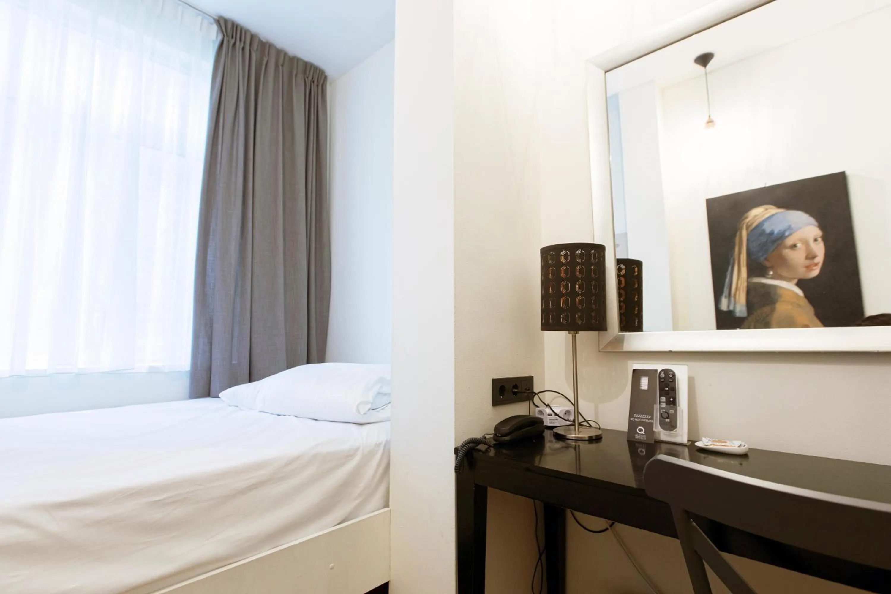 Bed in Quentin Amsterdam Hotel