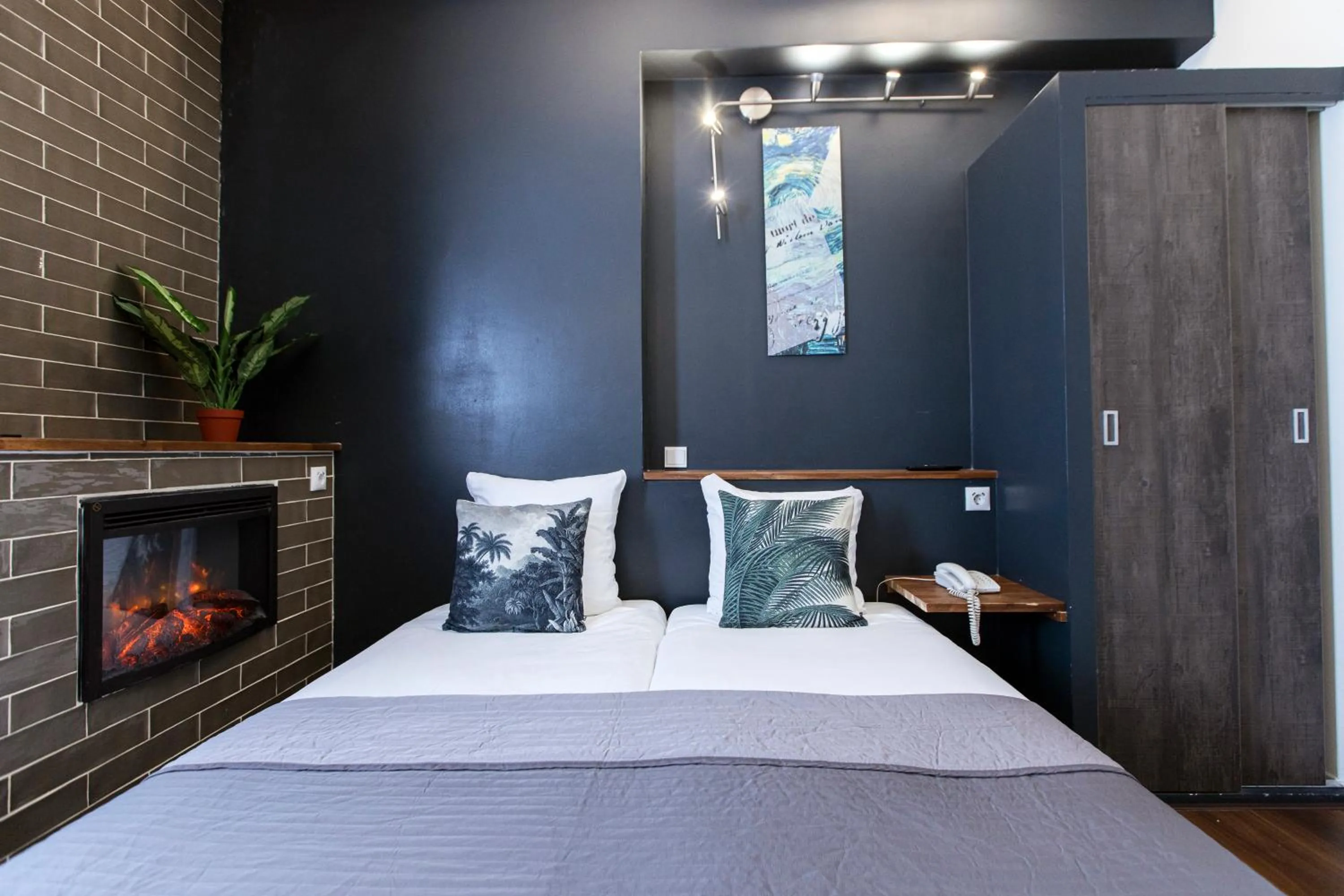 Bed in Quentin Amsterdam Hotel