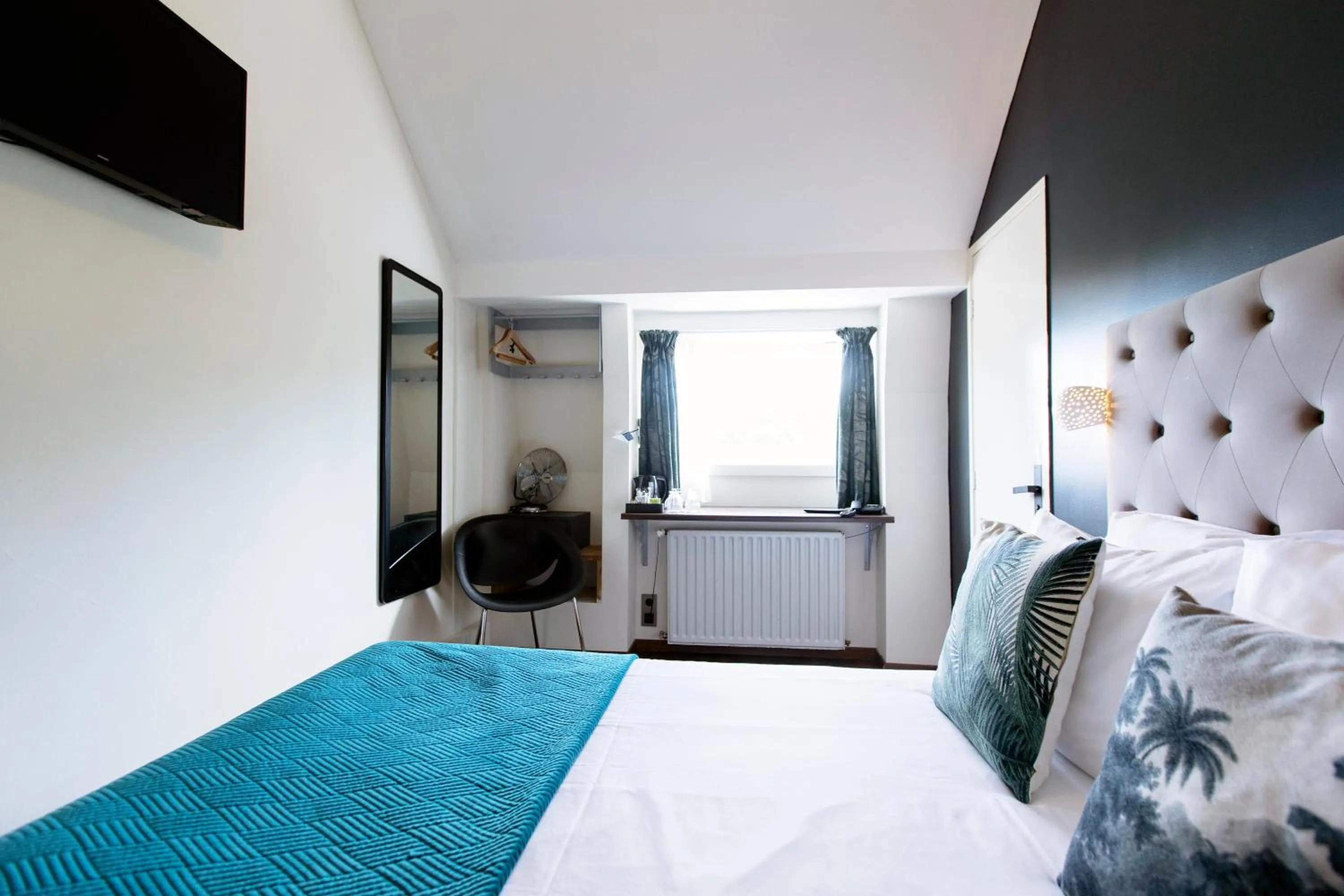 Bed in Quentin Amsterdam Hotel