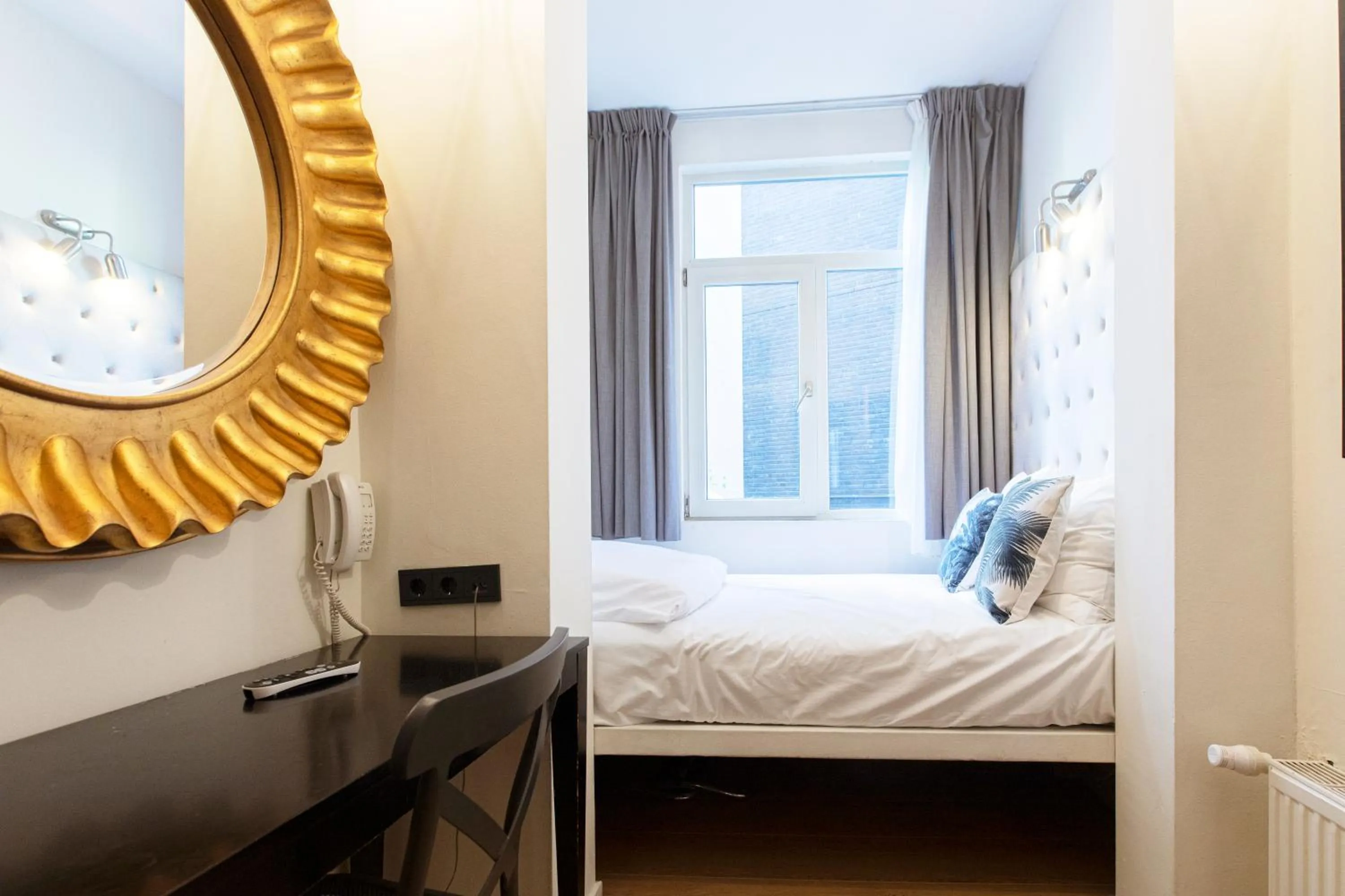 Bed in Quentin Amsterdam Hotel