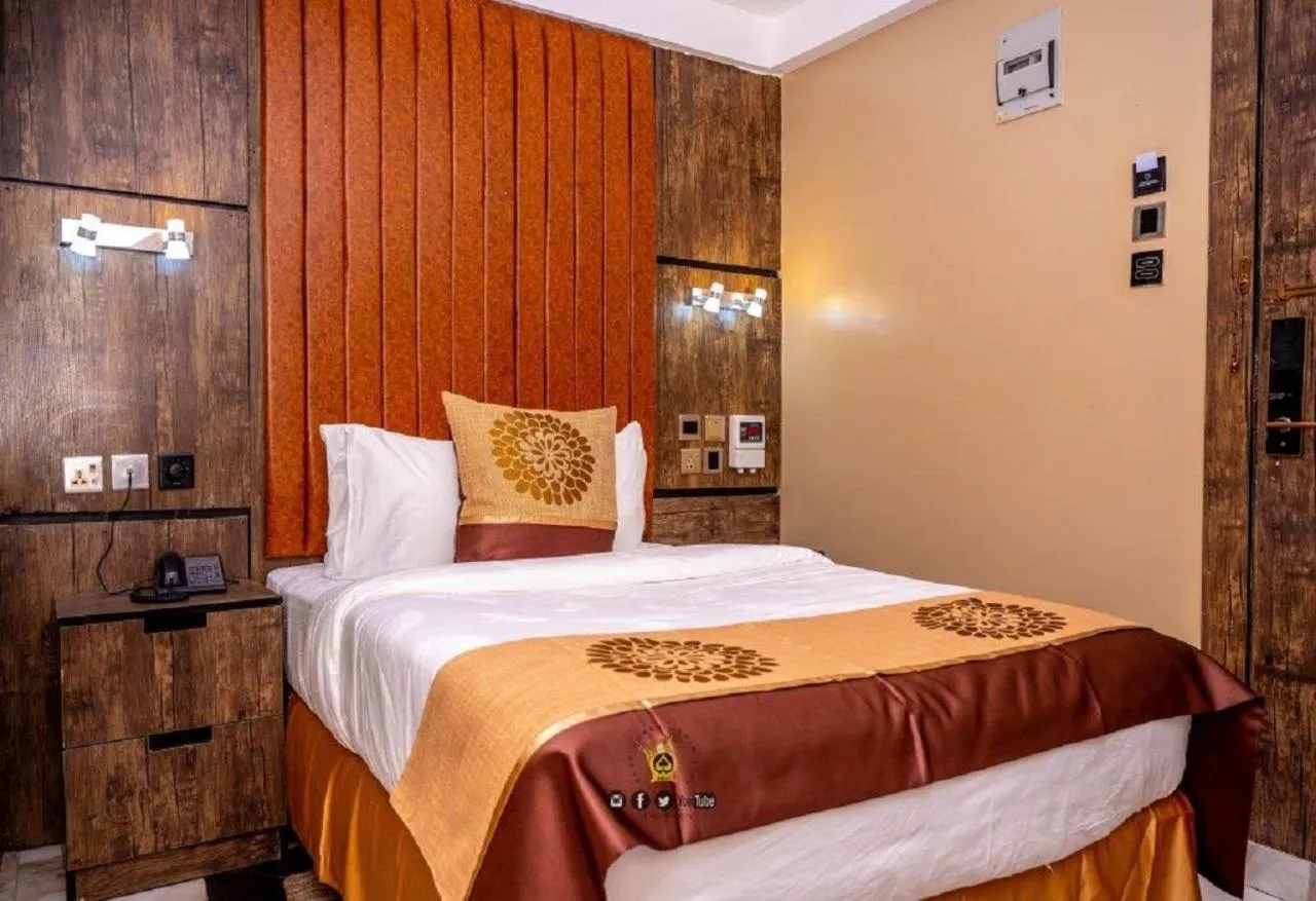 Bed in Joker Hotel and Suites