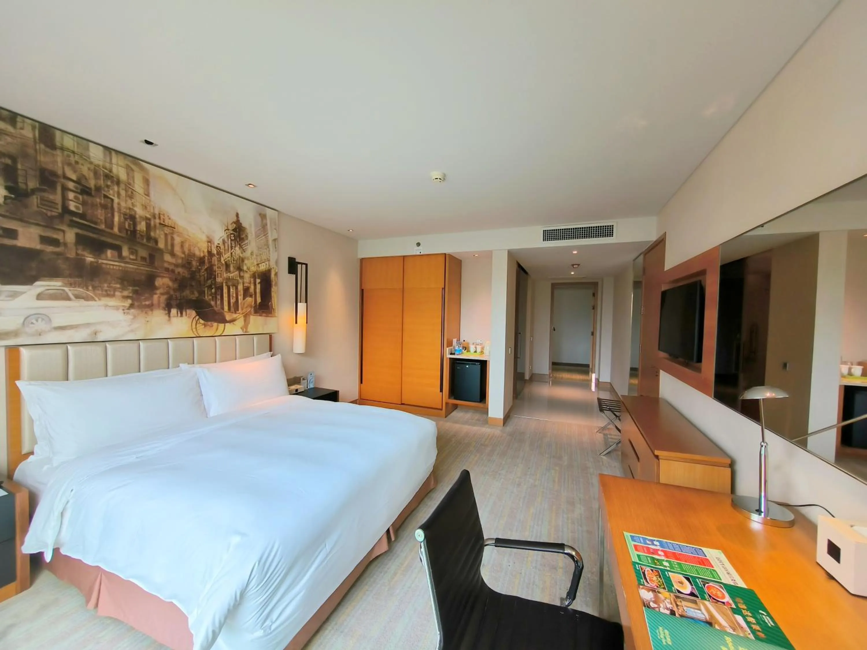 Photo of the whole room in Junluxe Hotel Guangzhou Science City-Free Shuttle Bus Service to Guangzhou Canton Fair