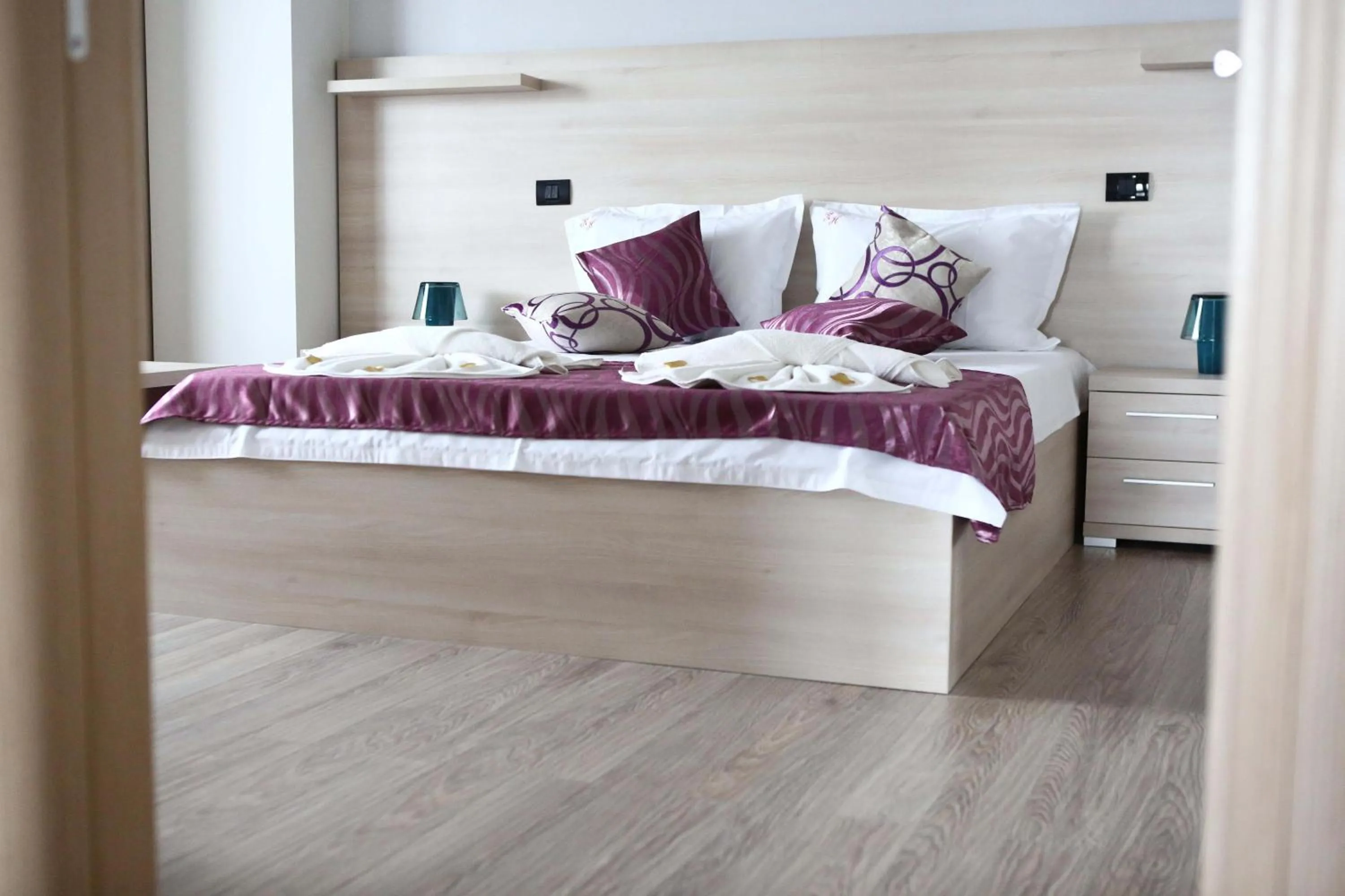 Bed in Kharisma Hotel