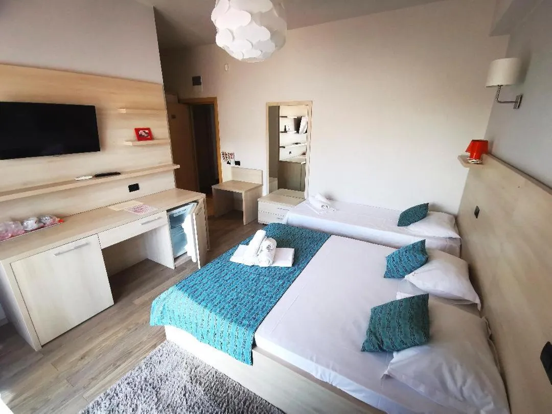 Bed in Kharisma Hotel