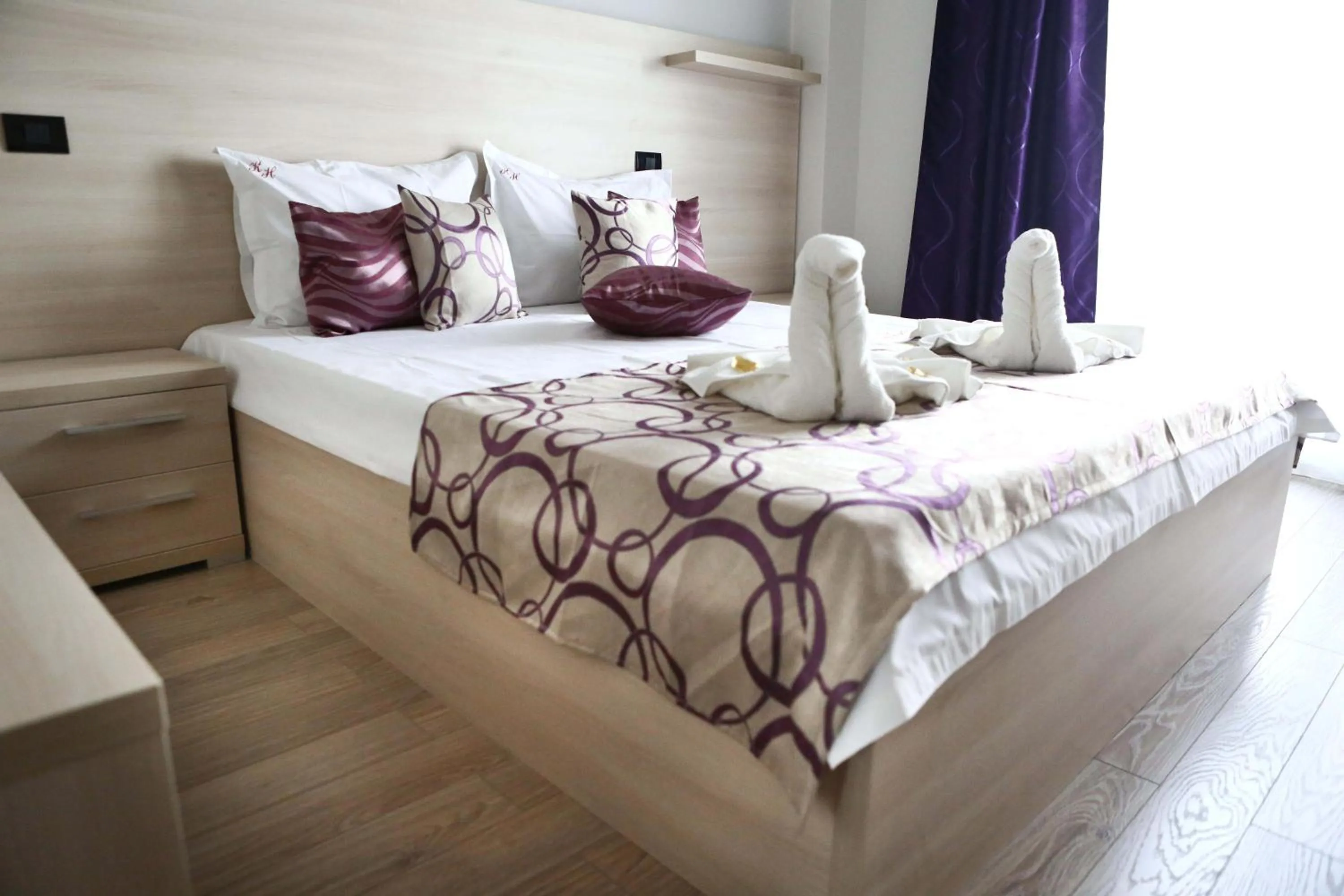 Bed in Kharisma Hotel