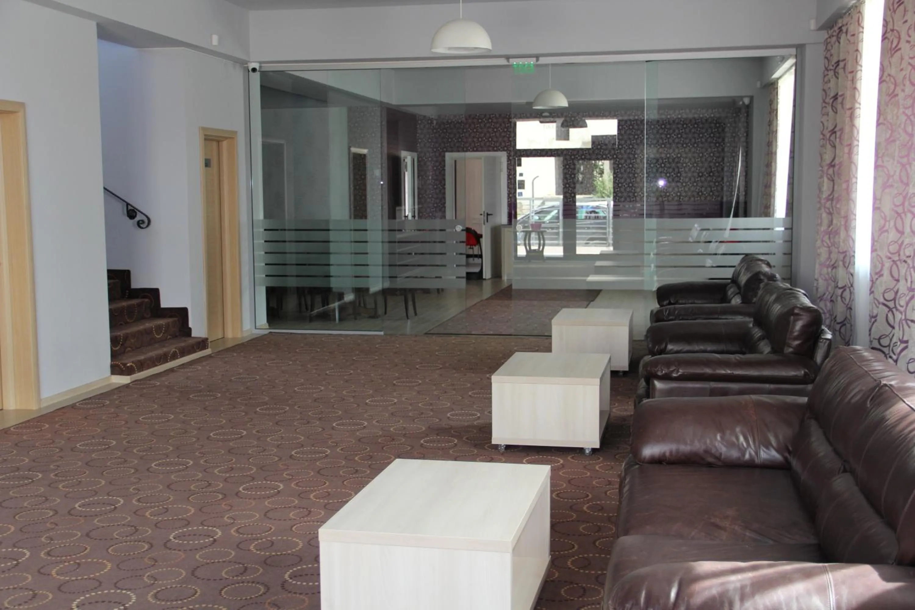 Communal lounge/ TV room in Kharisma Hotel