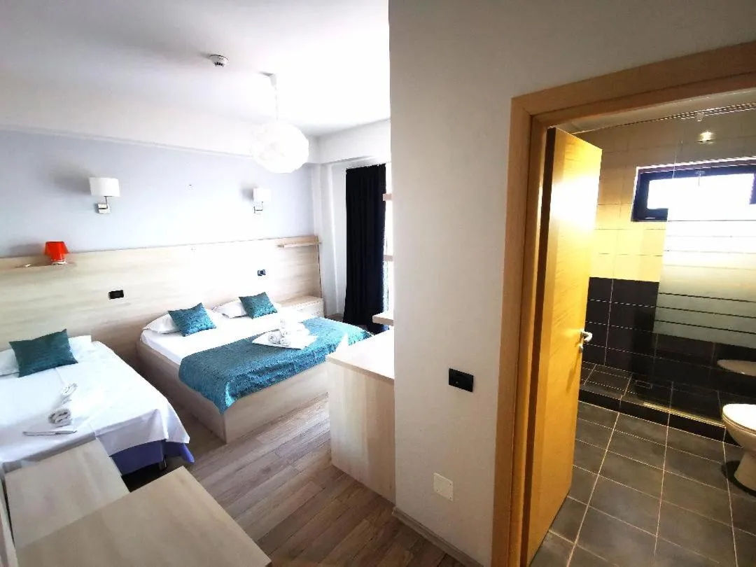 Bed in Kharisma Hotel