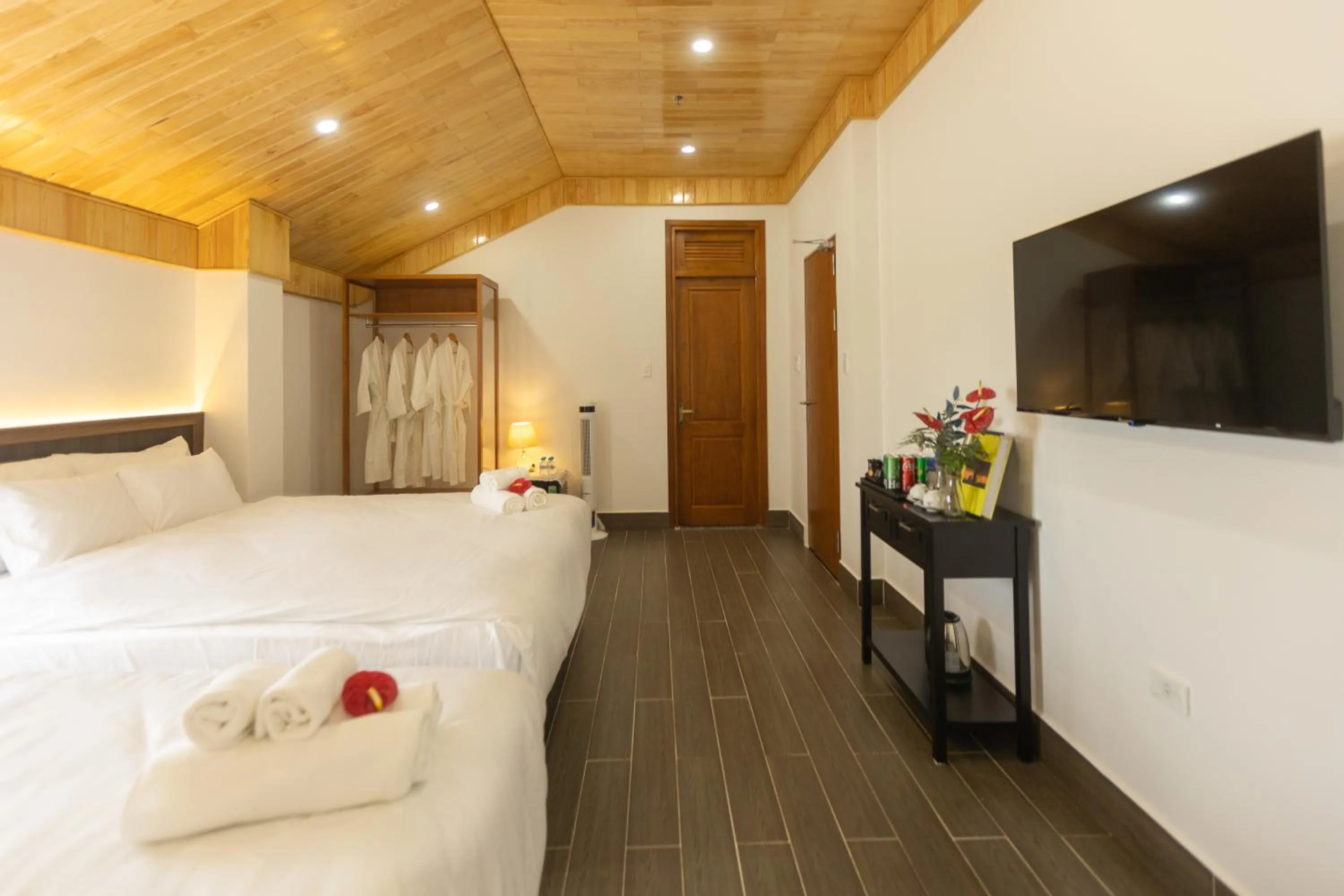 Communal lounge/ TV room, Bed in OLAGI HOTEL