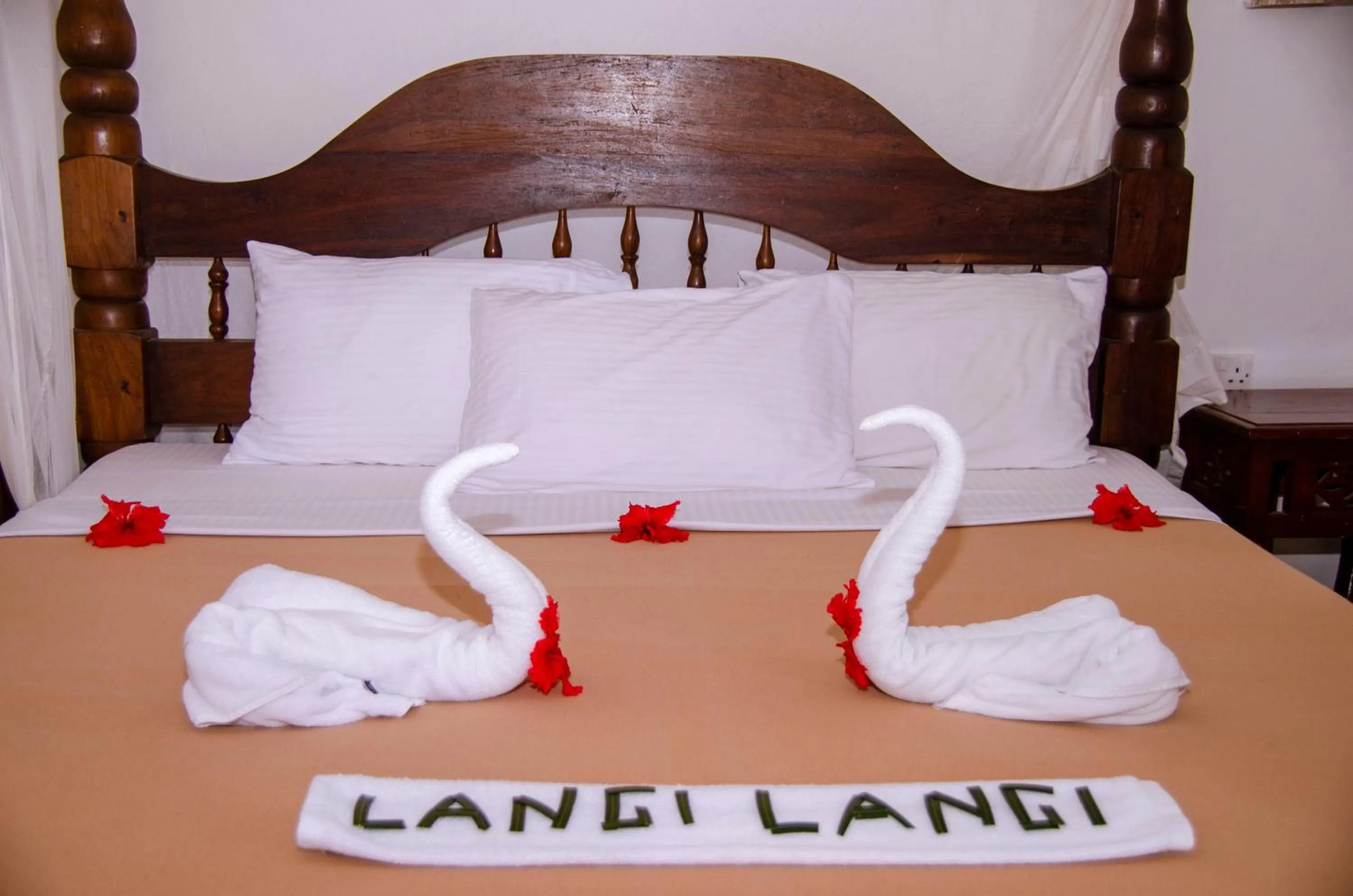 Bed in Langi Langi Beach Bungalows