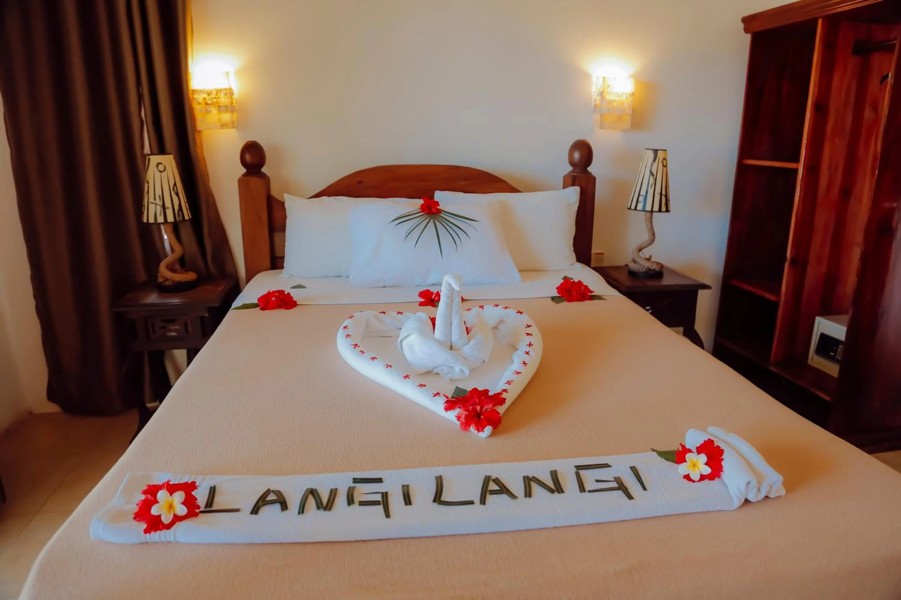 Bed in Langi Langi Beach Bungalows