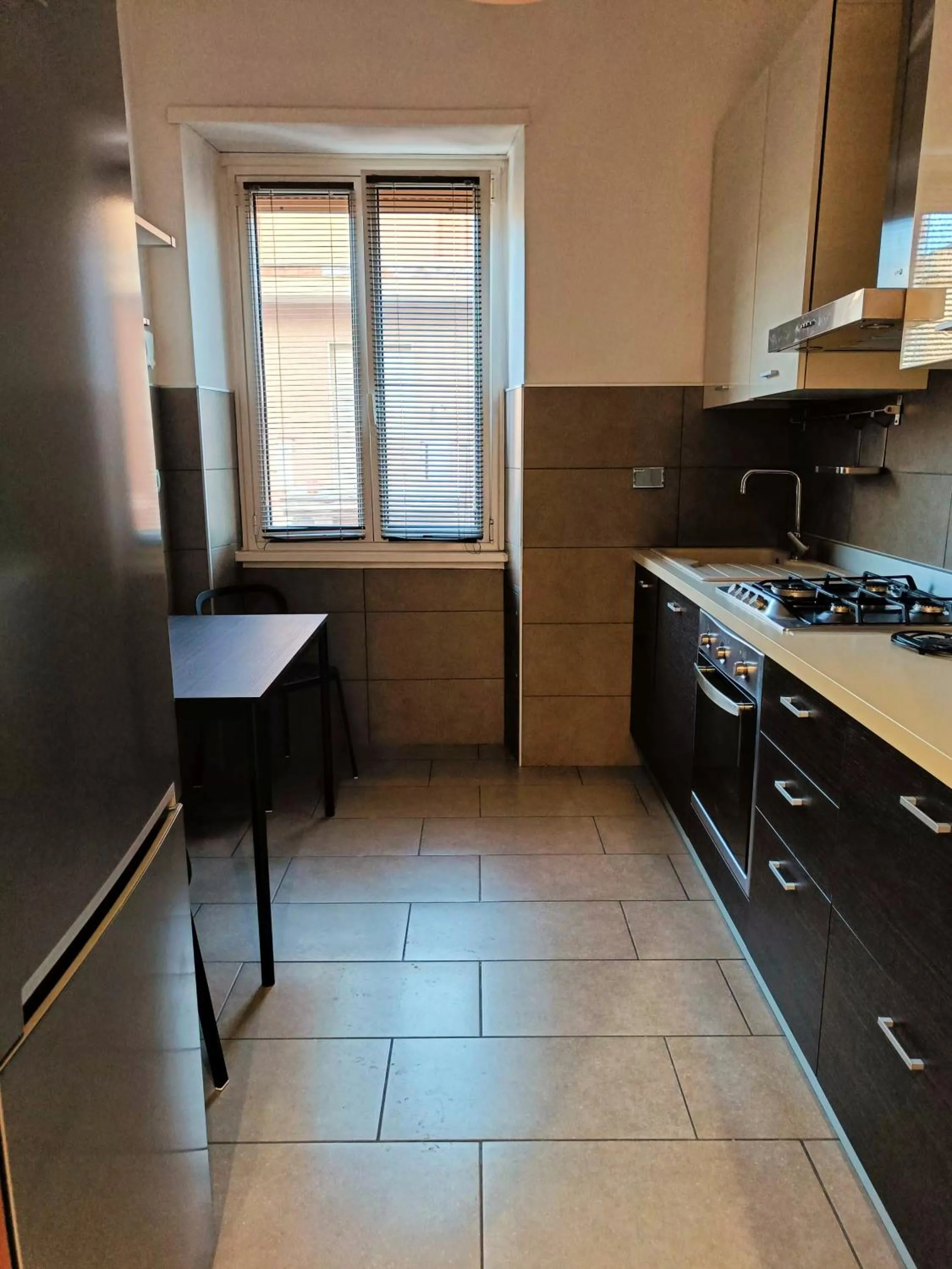 Kitchen or kitchenette in Tia Tourist Apartment Rome