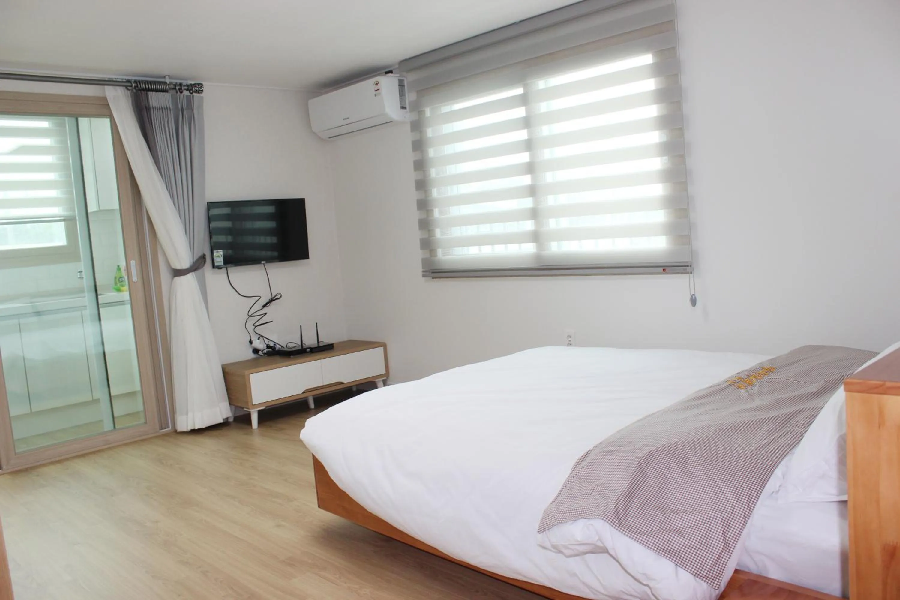 Bed in Jeju Aria Pension