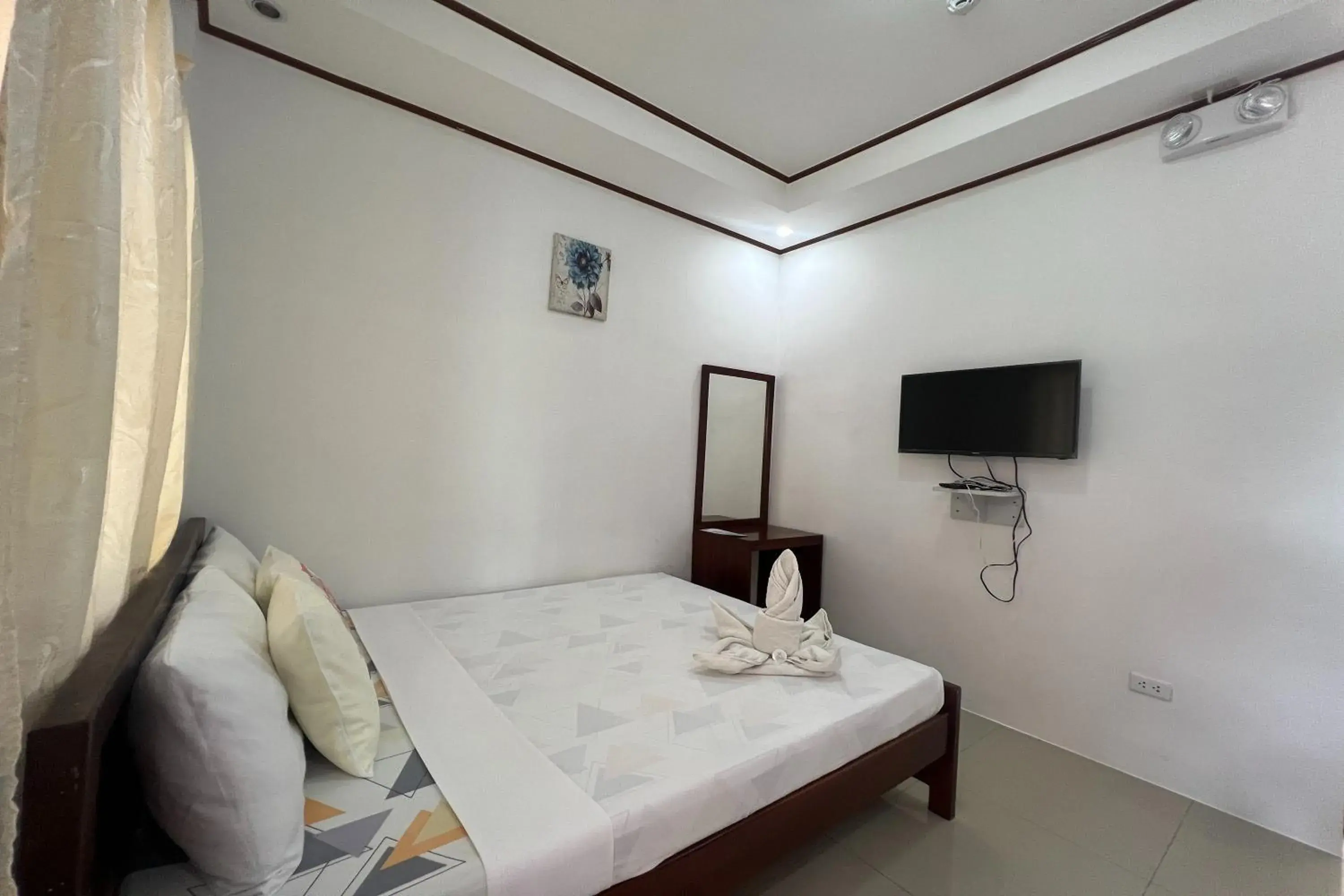 Bed in Dinah's Tourist Inn Puerto Princesa Bed in Dinah's Tourist Inn Puerto Princesa