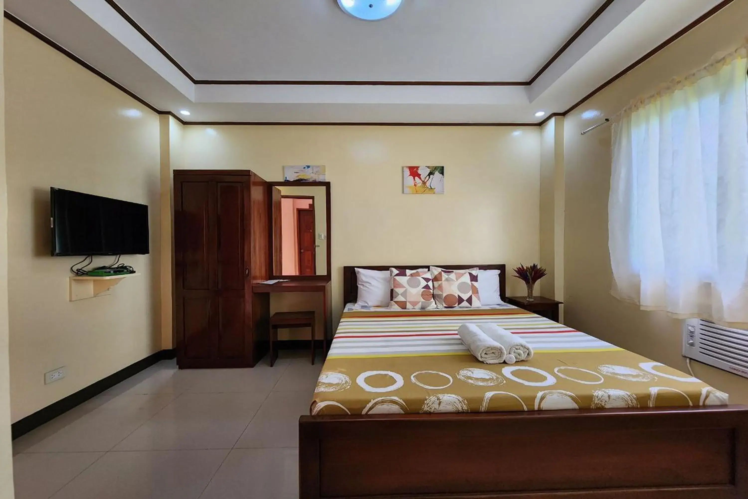 Bed in Dinah's Tourist Inn Puerto Princesa Bed in Dinah's Tourist Inn Puerto Princesa