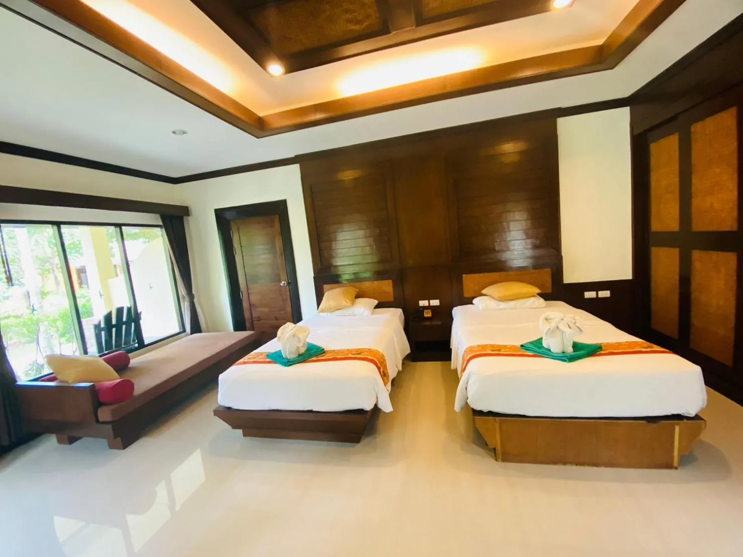 Bed in Hotel and Beach Bungalow at Lanta Resort