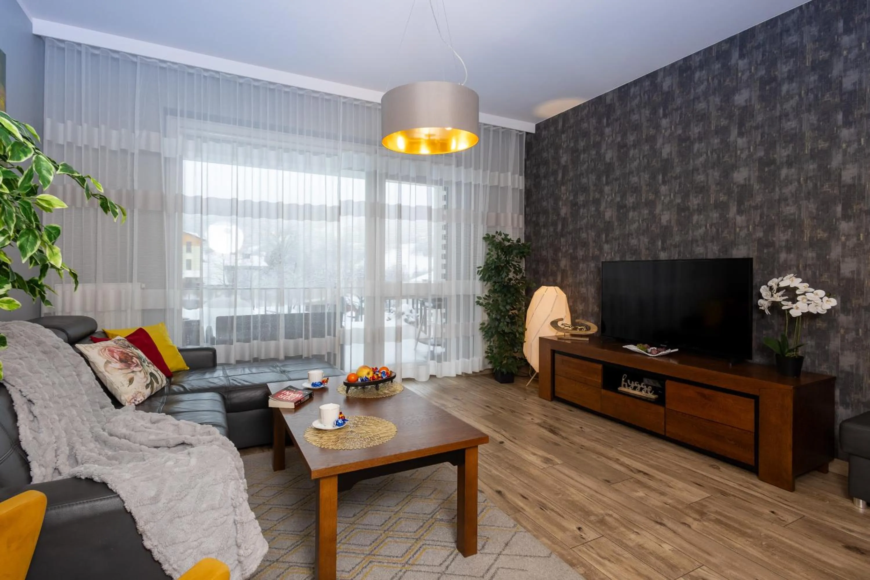 Communal lounge/ TV room in Apartament ZEUS - Beskid Apartment