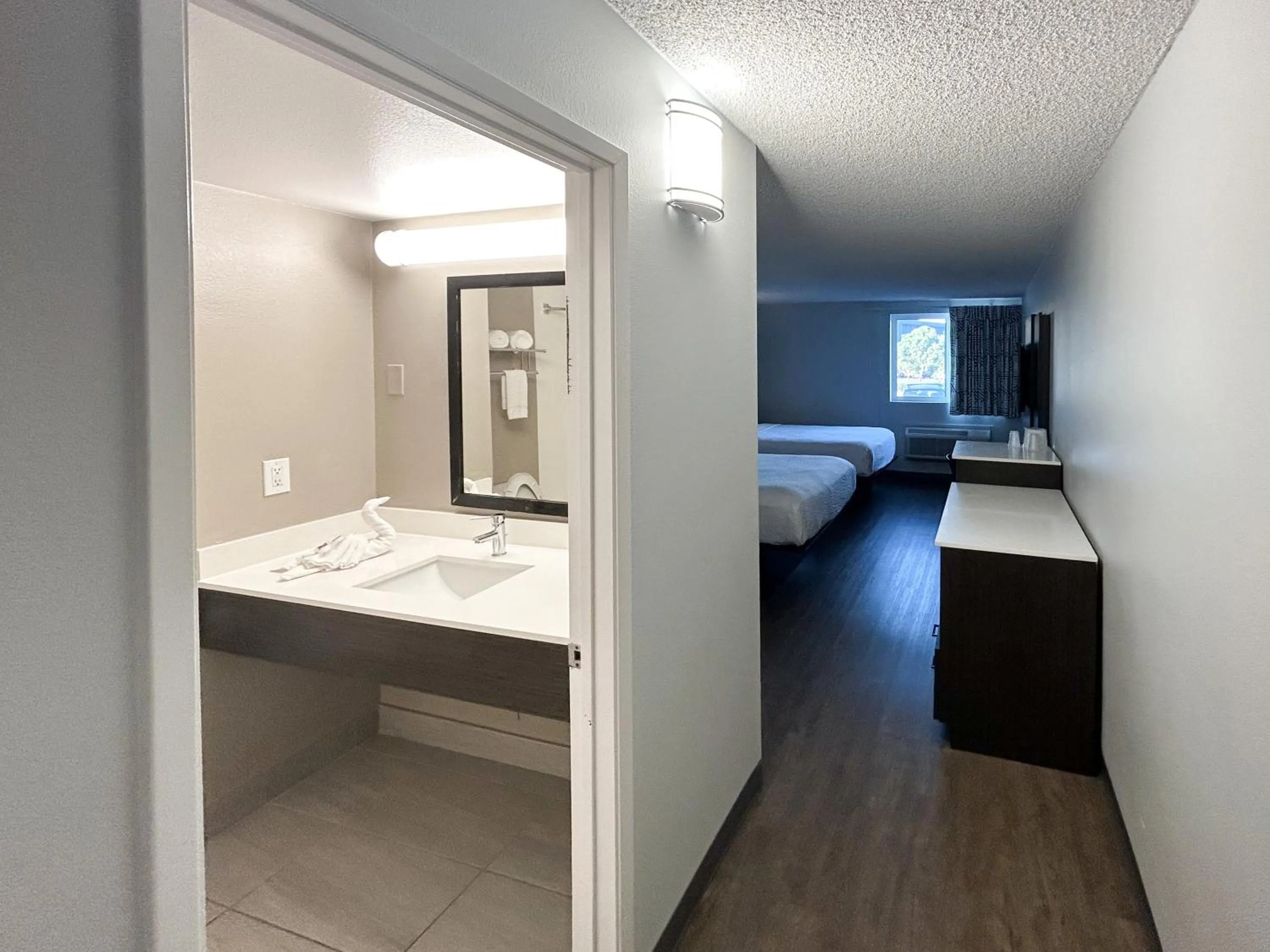 Bedroom, Bed in Studio 6 Suites Carson, CA