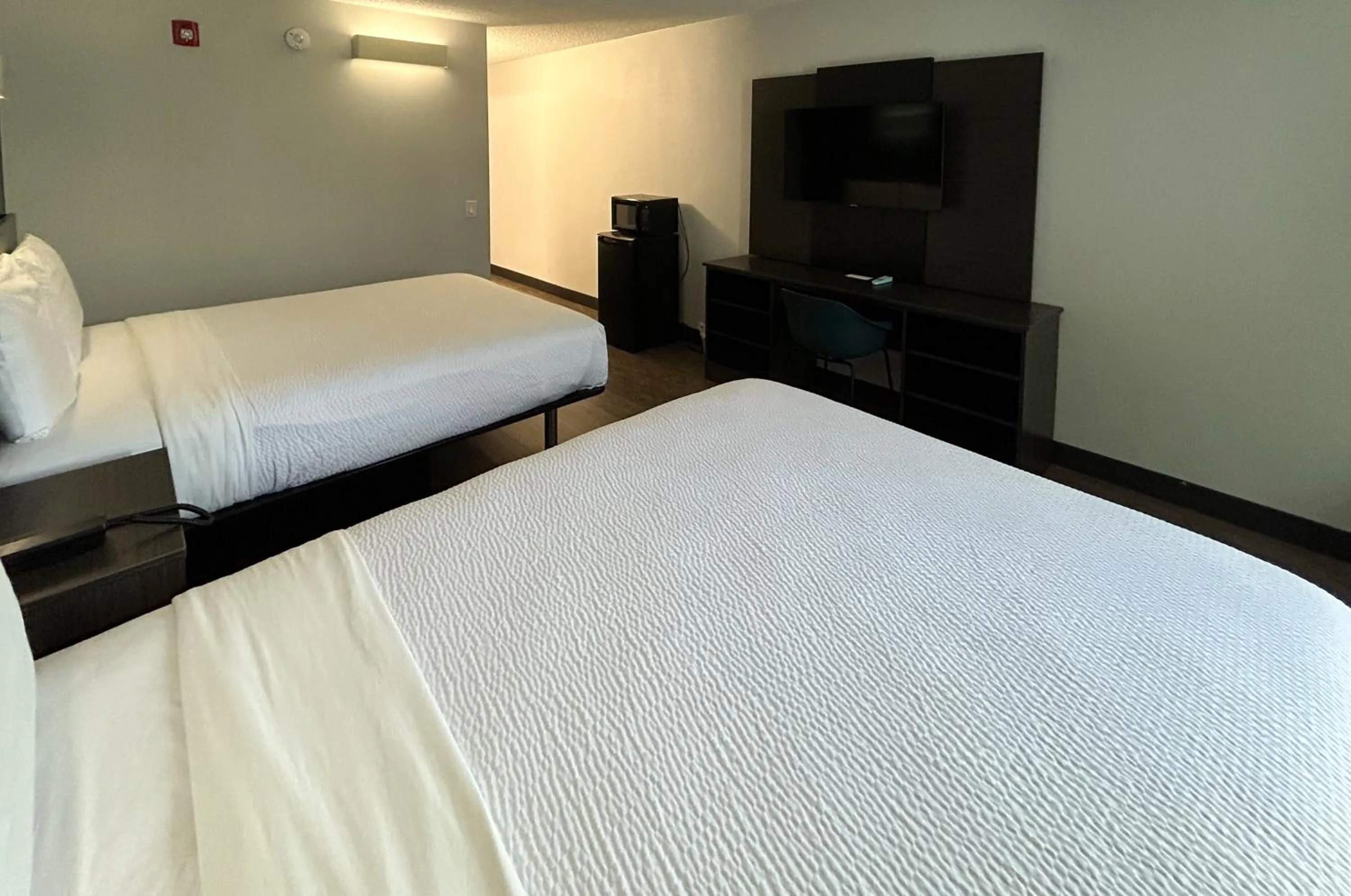 Bedroom, Bed in Studio 6 Suites Carson, CA